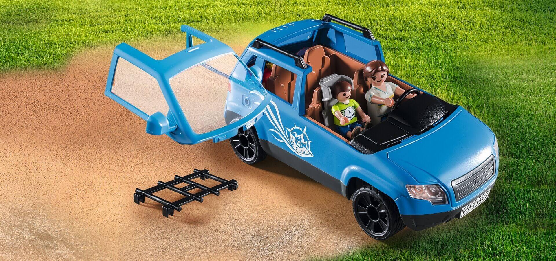 Blue PLAYMOBIL toy car with opening doors and family figures inside – part of Caravan with Car set