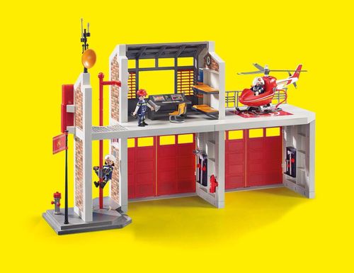 Playmobil 9462 Fire Station playset with multi-storey building, helicopter and accessories on yellow background