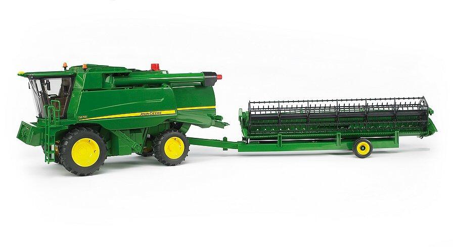 Bruder John Deere T670i toy combine harvester with header loaded on trailer
