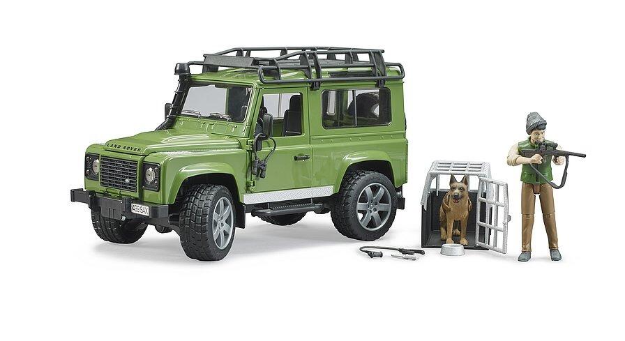 Green off-road vehicle with standing forester figure beside it