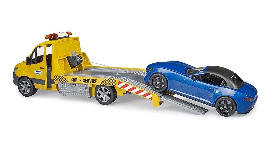 Rear view of the Mercedes-Benz Sprinter transporter toy with the blue roadster secured on the back.