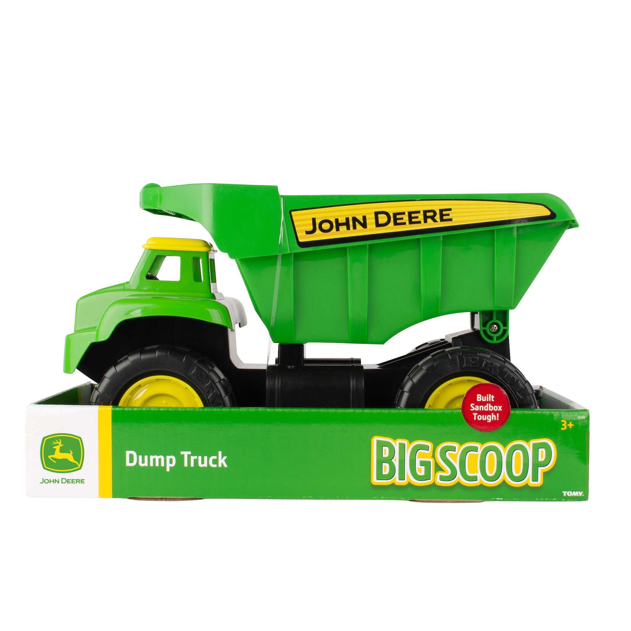 Side view of John Deere Big Scoop dump truck toy in green and yellow on a white background.
