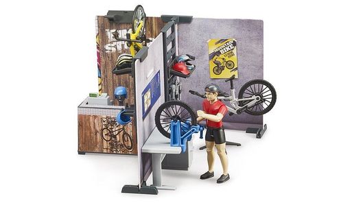 Bruder Bike Shop and Service set with workshop tools and yellow mountain bike.