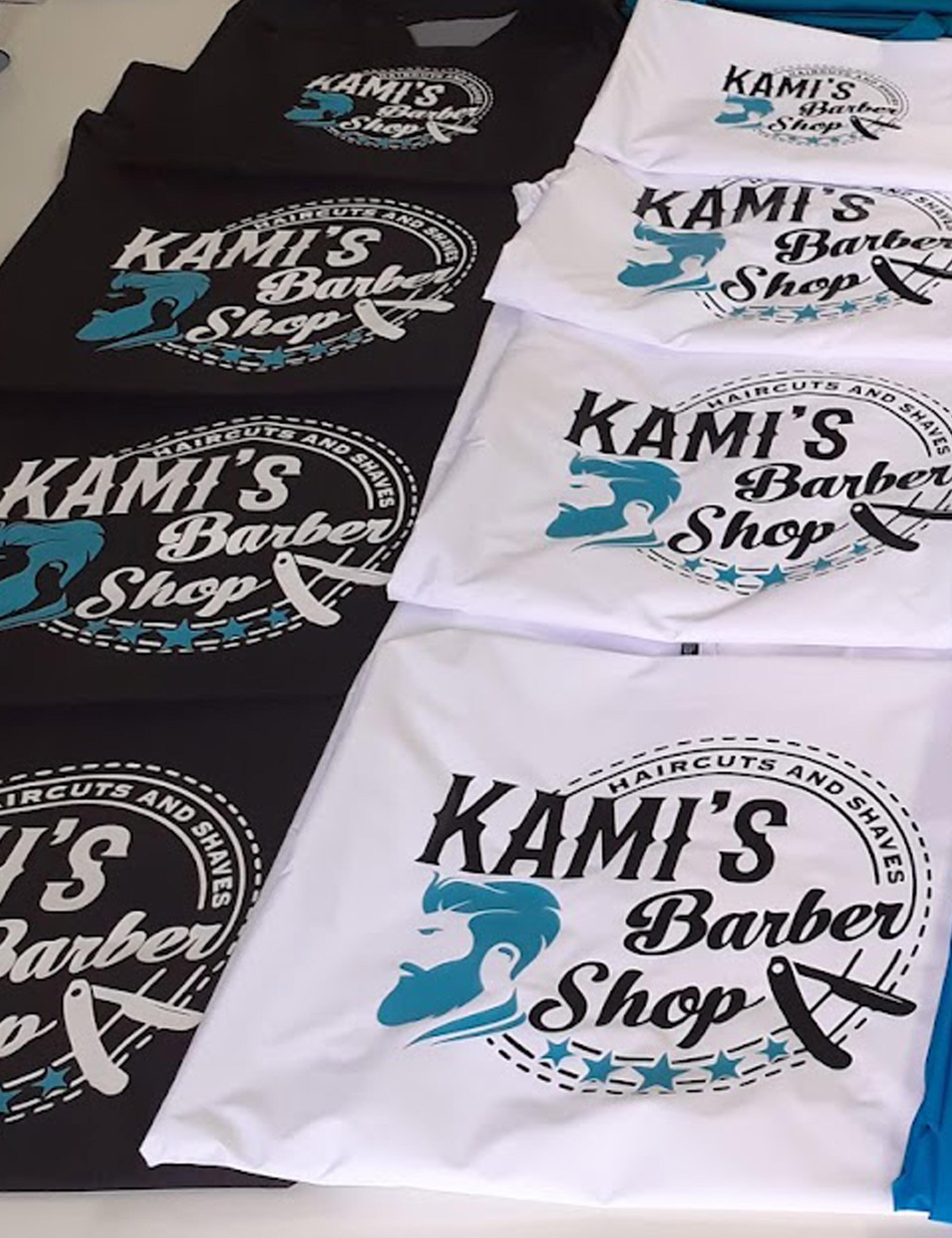 Custom printed white salon cape with personalized hairdresser logo