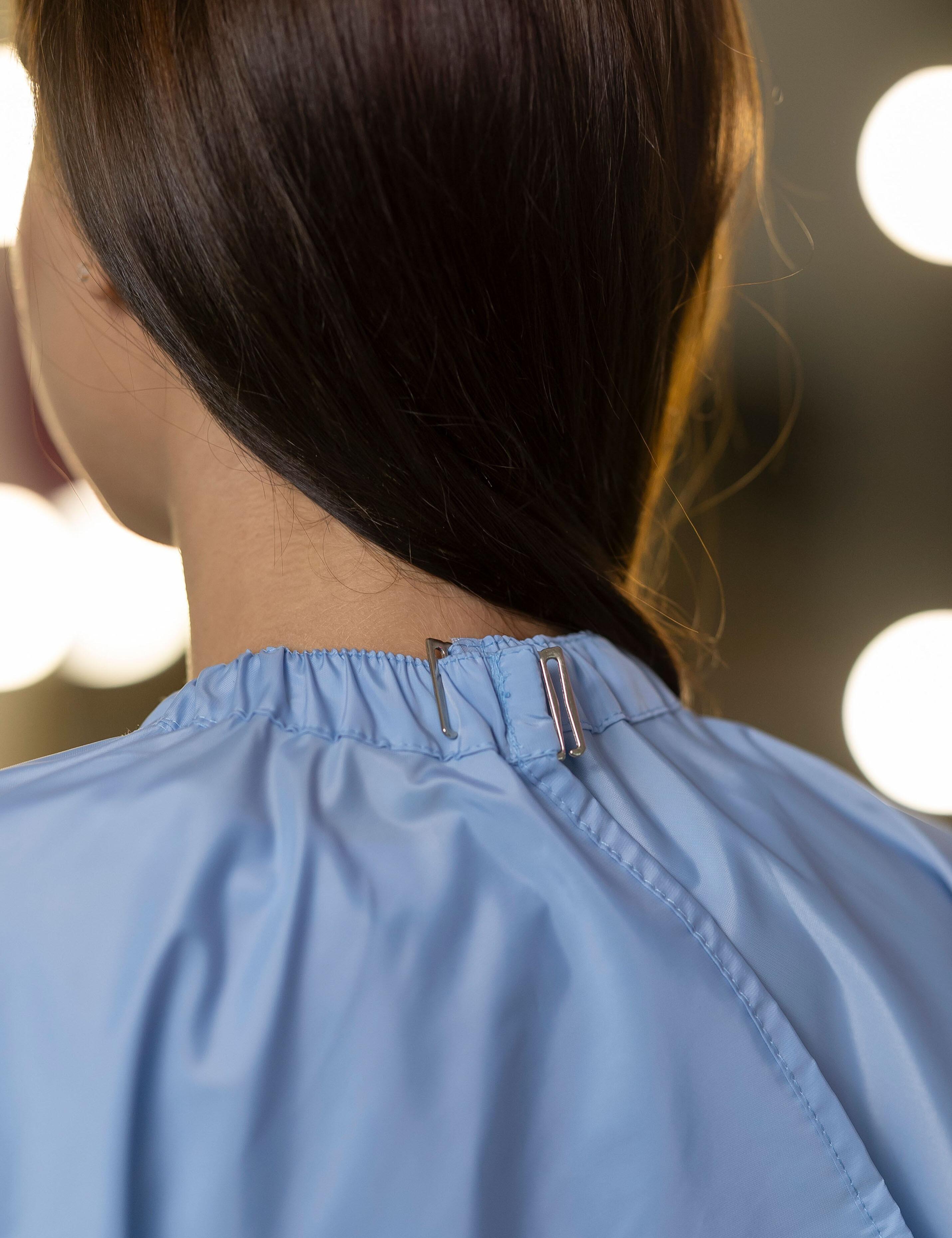 Professional light blue barber gown with adjustable neck clips for US shops