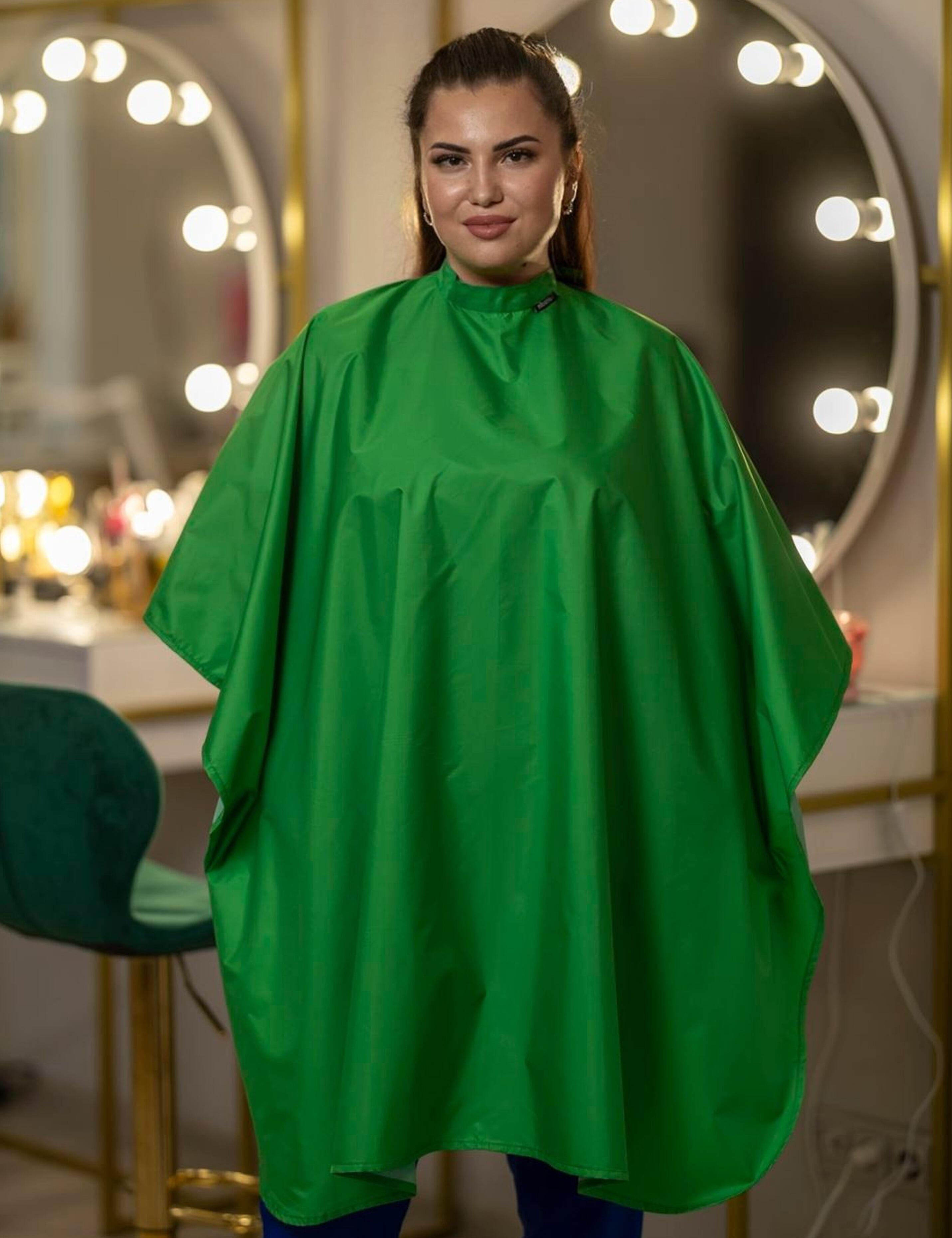 Front view of a vibrant kelly green salon cape for clients