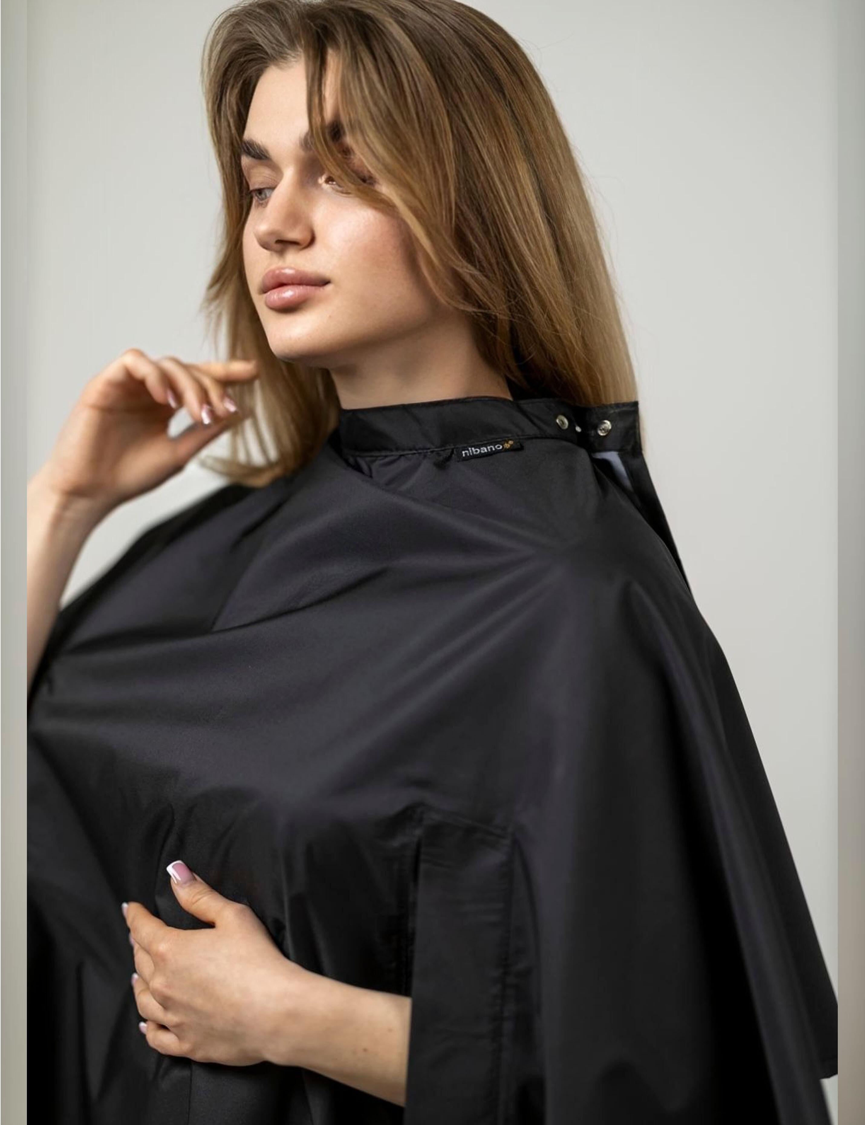 Black hairdressing gown with hand openings allowing phone use during hair cuts