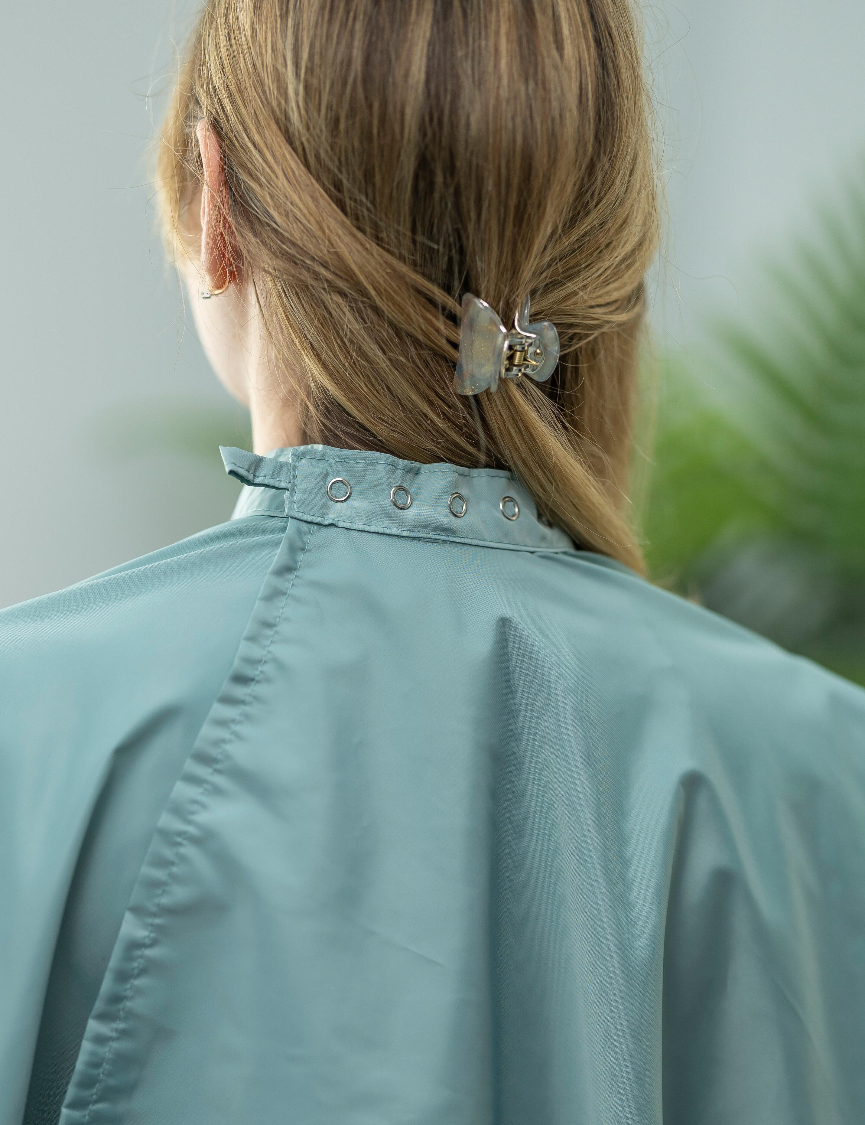 Sage salon cape with hand slits and adjustable snap closure