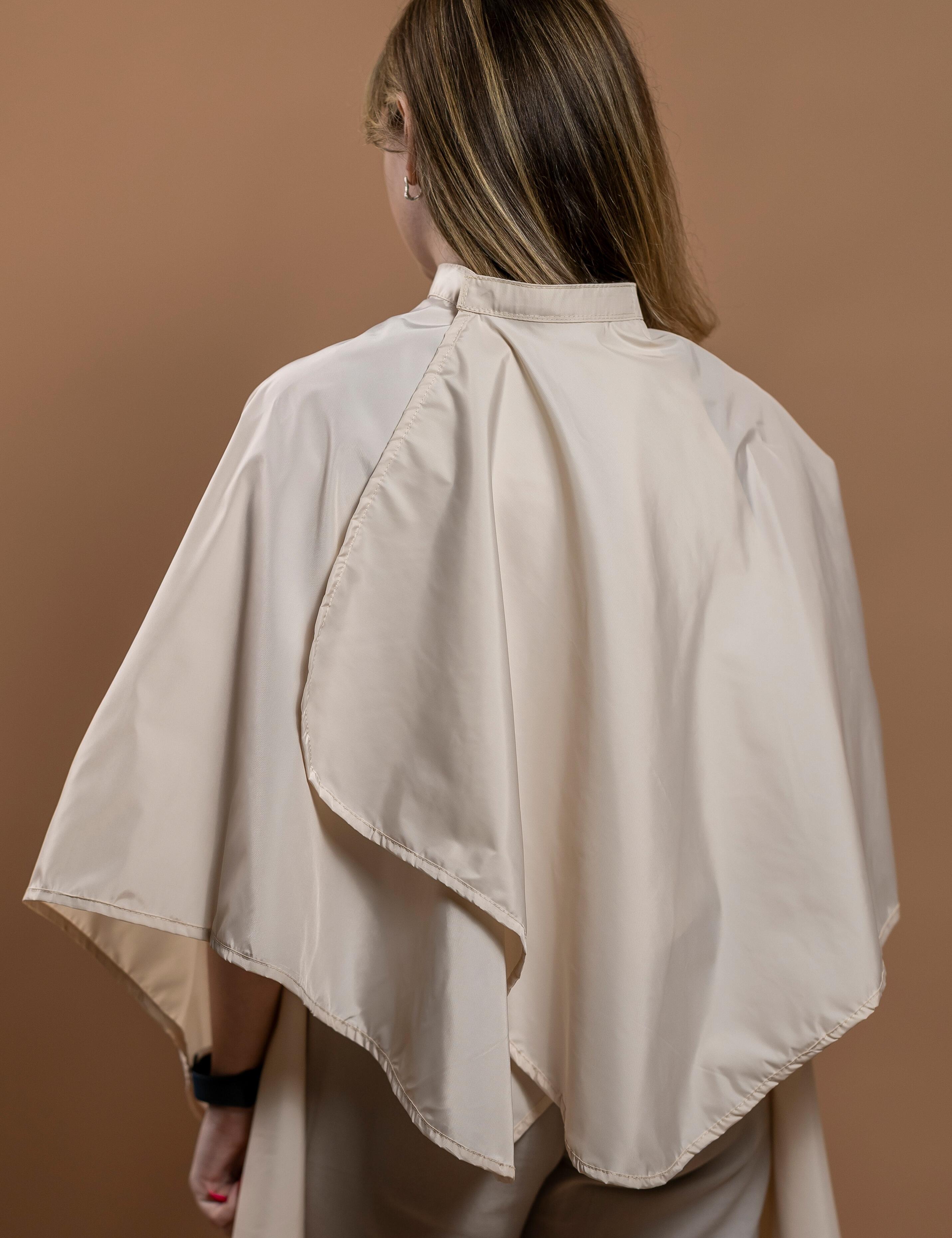 Stain-resistant cream barber gown to keep clients safe and dry