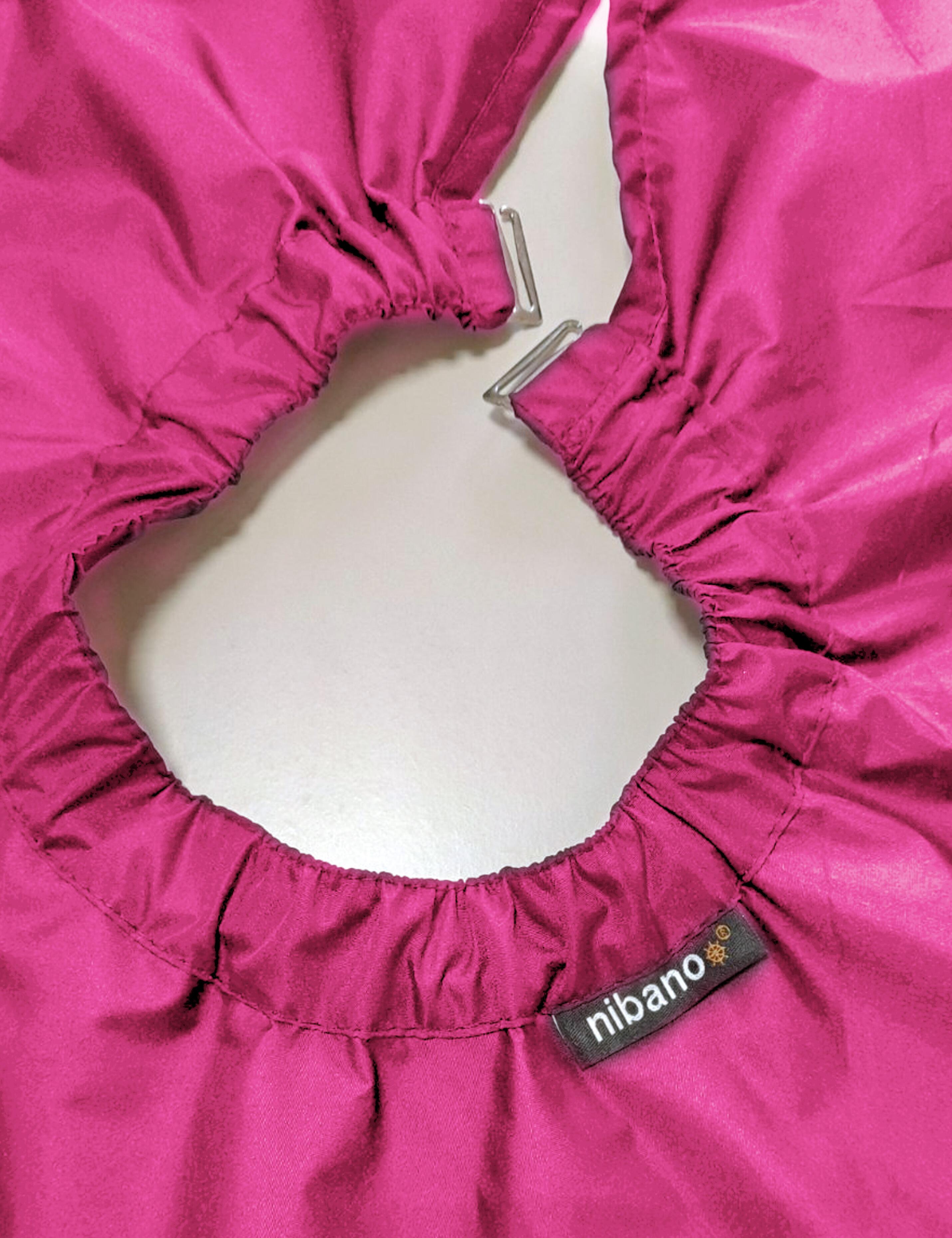 Professional hot pink barber gown equipped with adjustable neck clips for US shops.