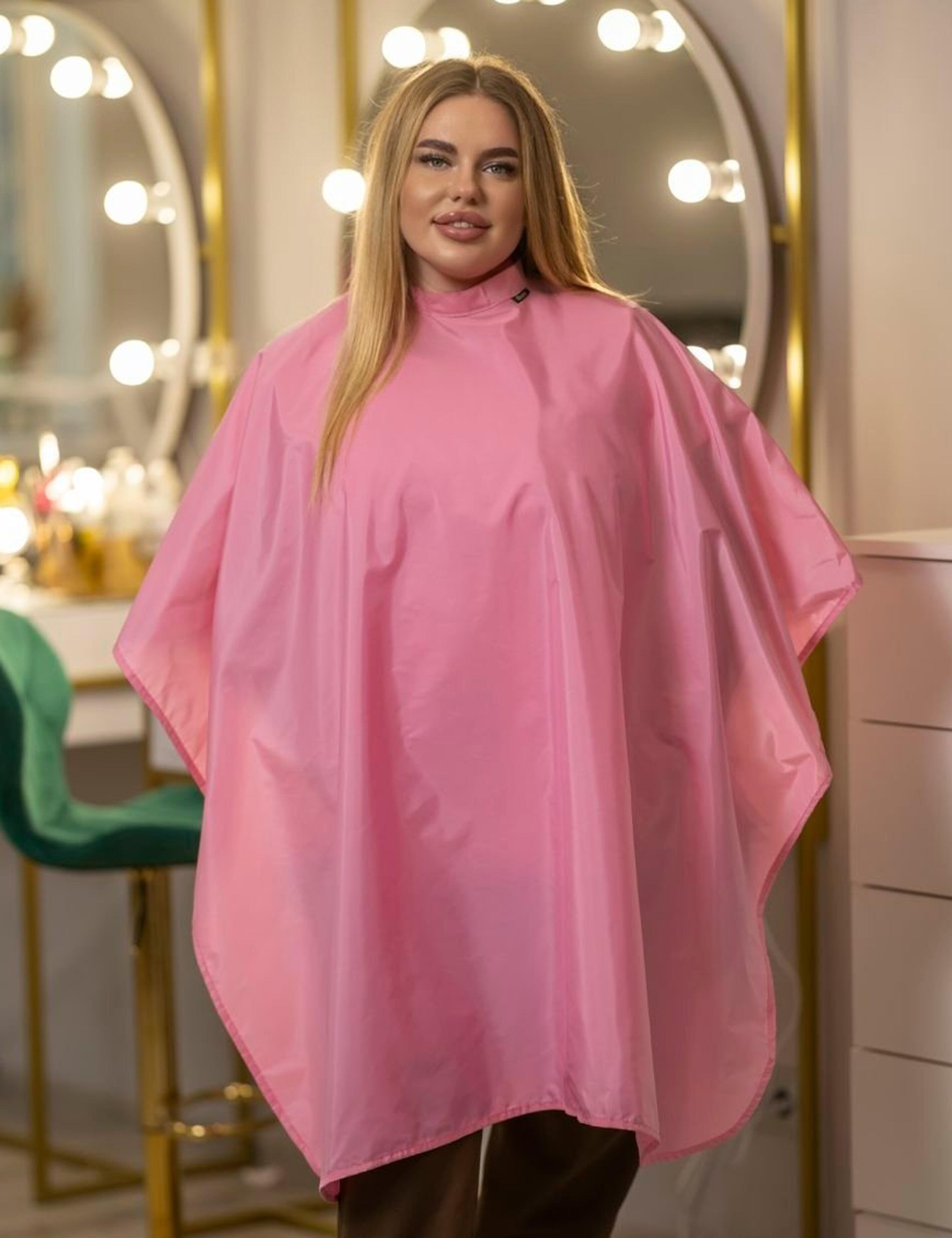 Full-length pink barbie styling gown providing complete coverage for fashion salon clients.