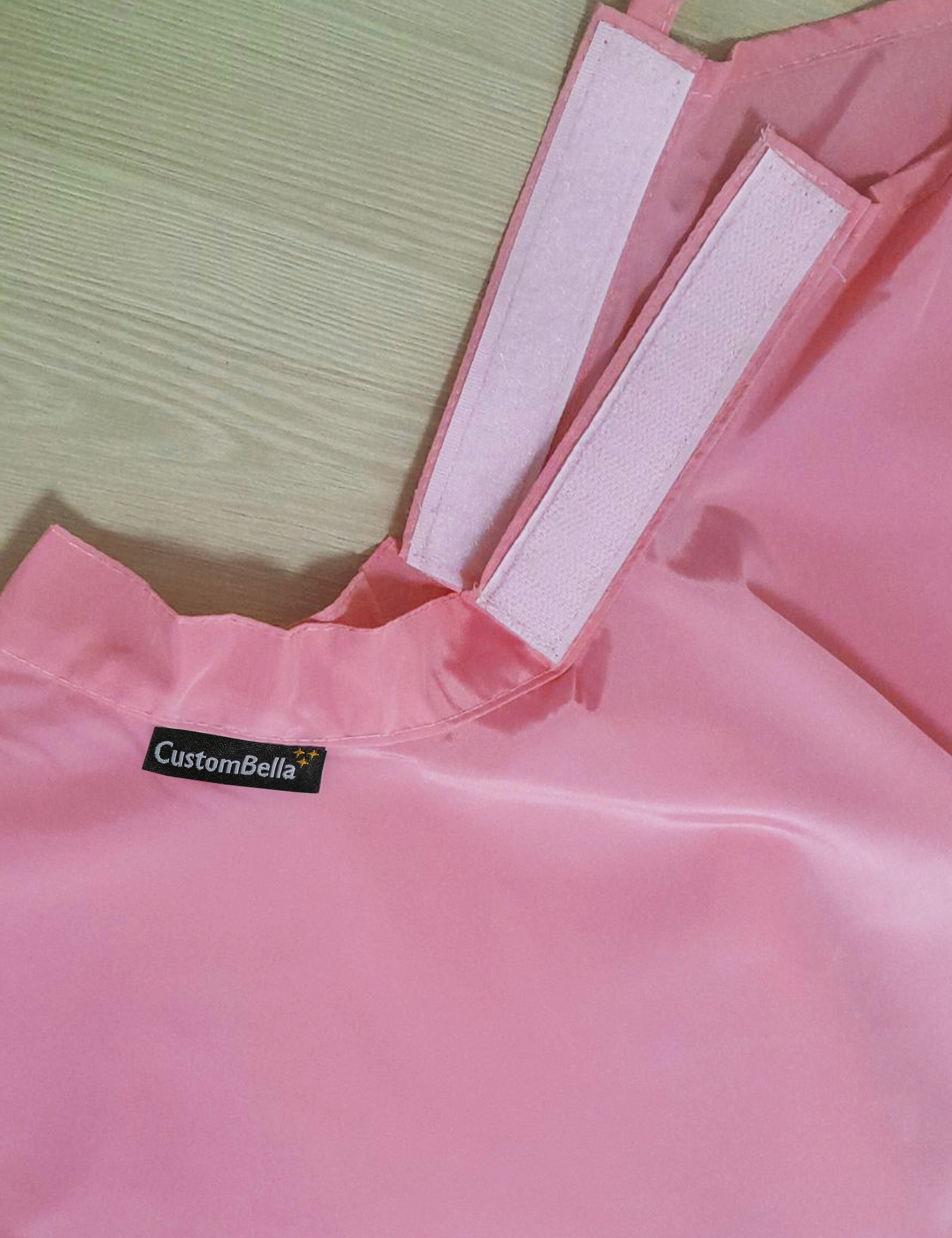 Barbie pink kids salon cape with an adjustable velcro neck closure