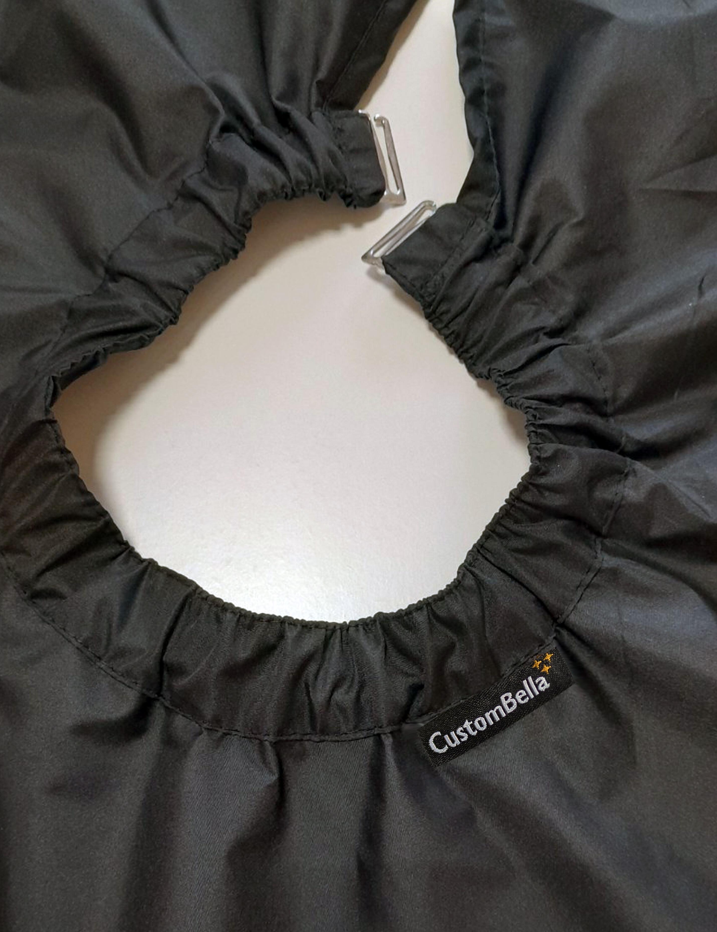 Black barber cape with hand slits fitted with secure metal neck clips