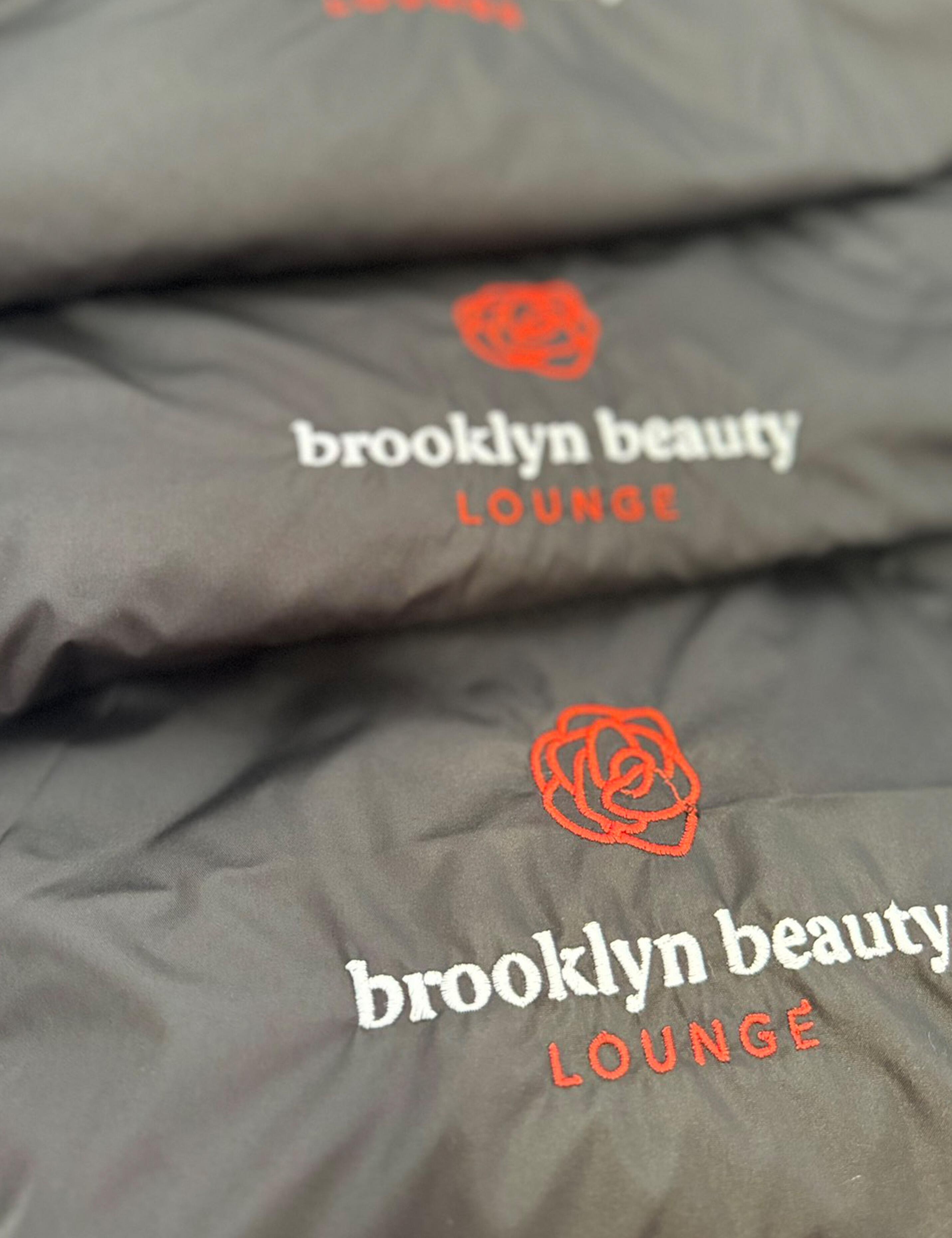 Premium embroidered dark grey salon cape with custom personalized logo