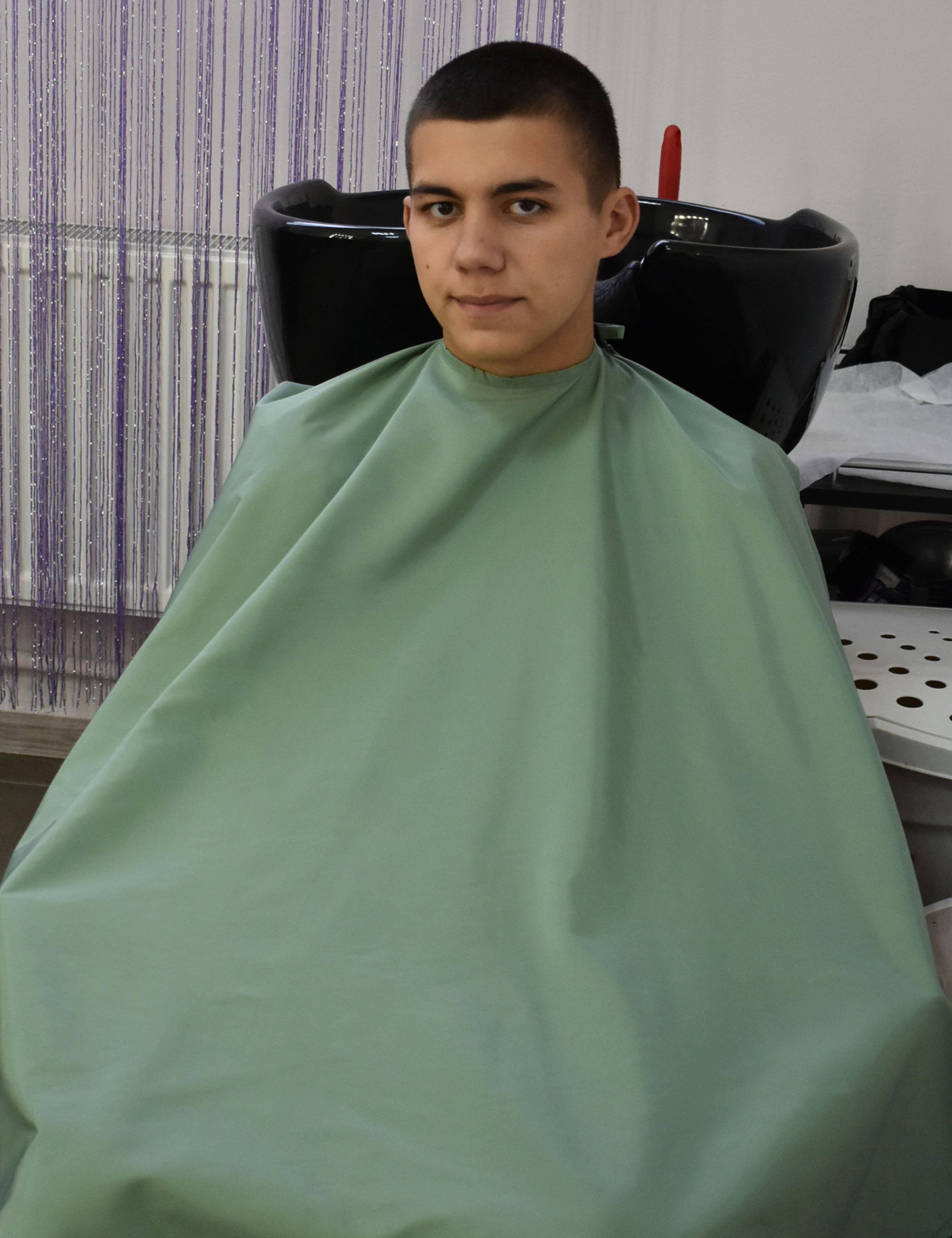 Trendy olive green cape for modern barbershops and US hair artists