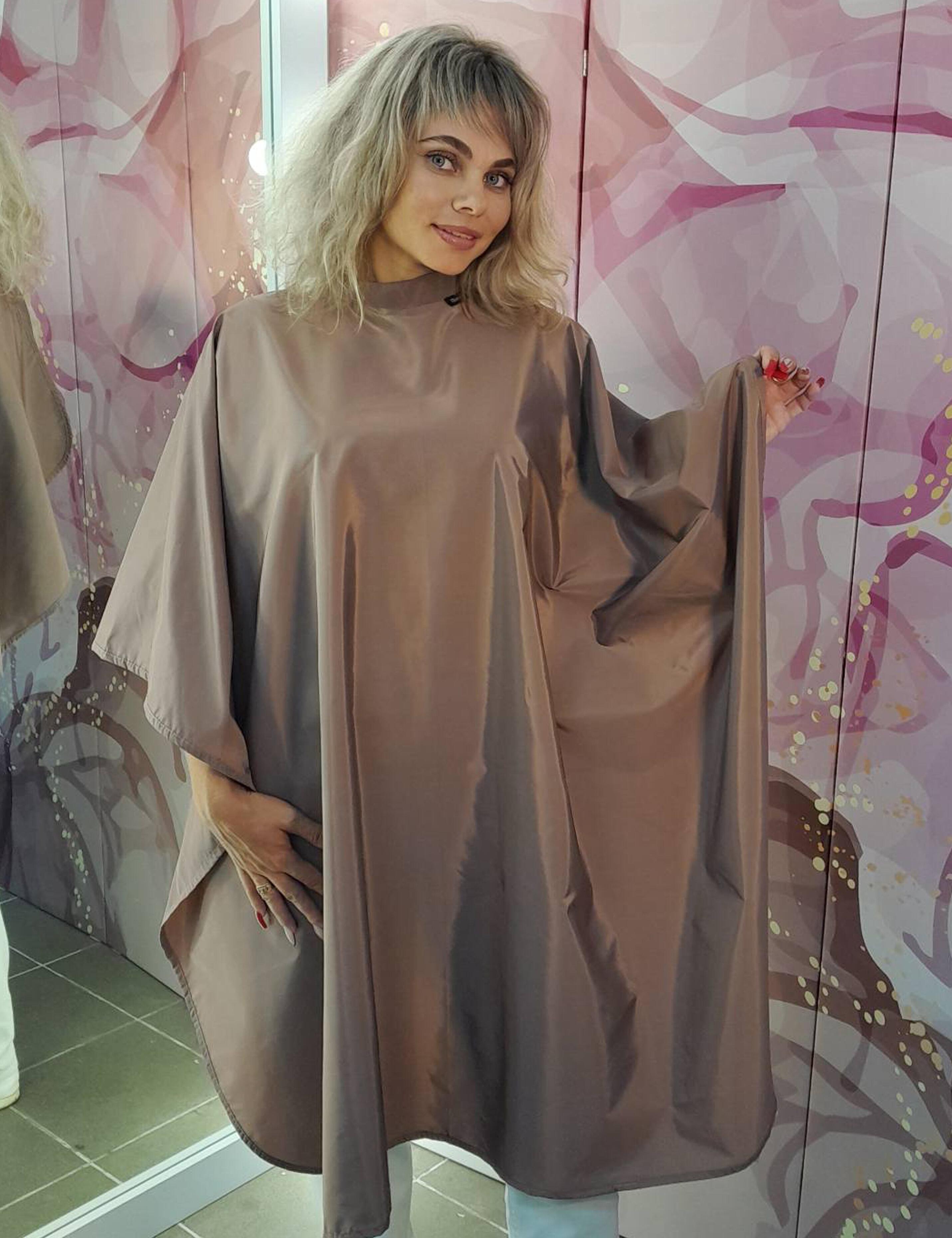 Full-coverage coffee styling cape designed for ultimate client service