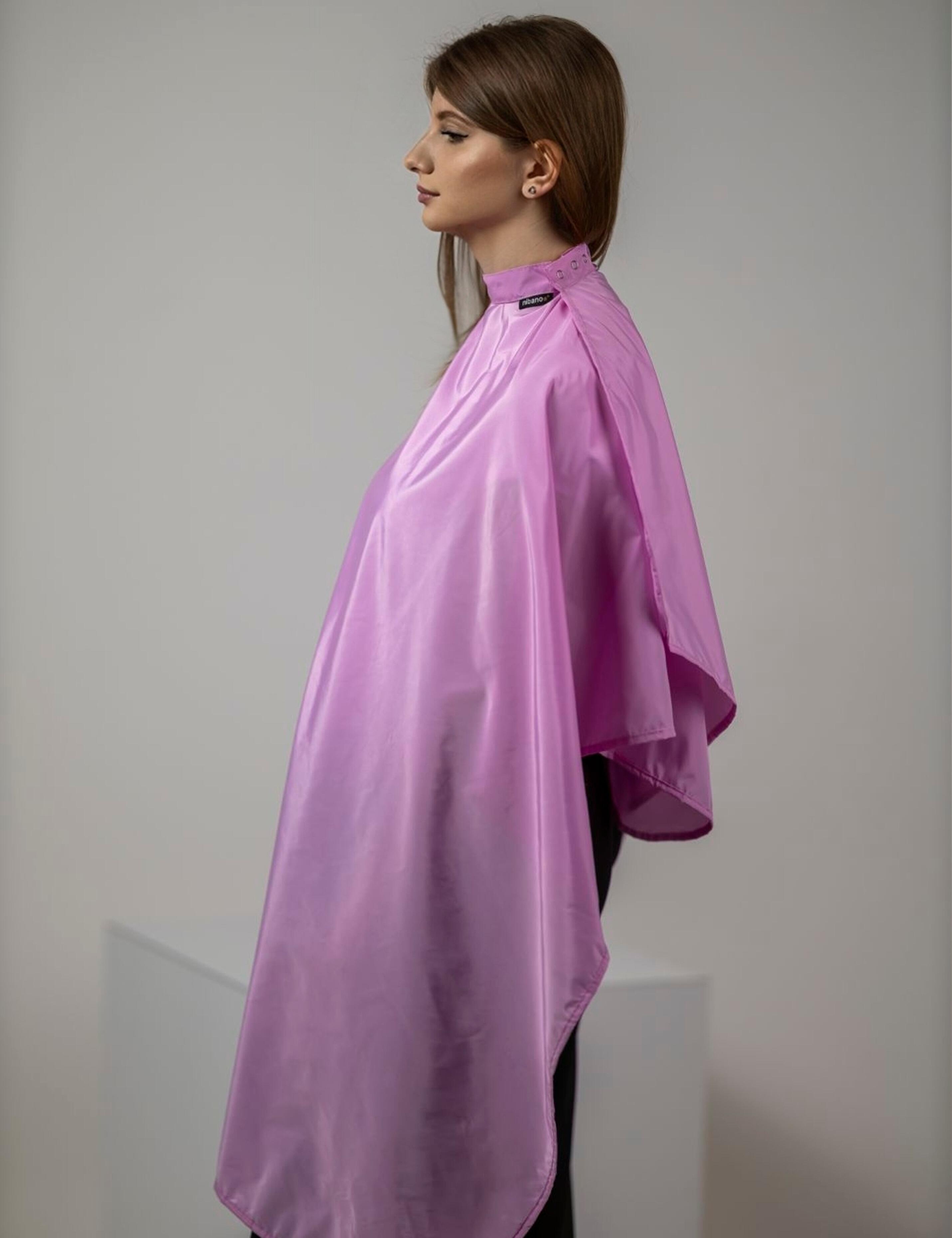 Full-coverage pink color cape ensuring ultimate client protection and comfort.