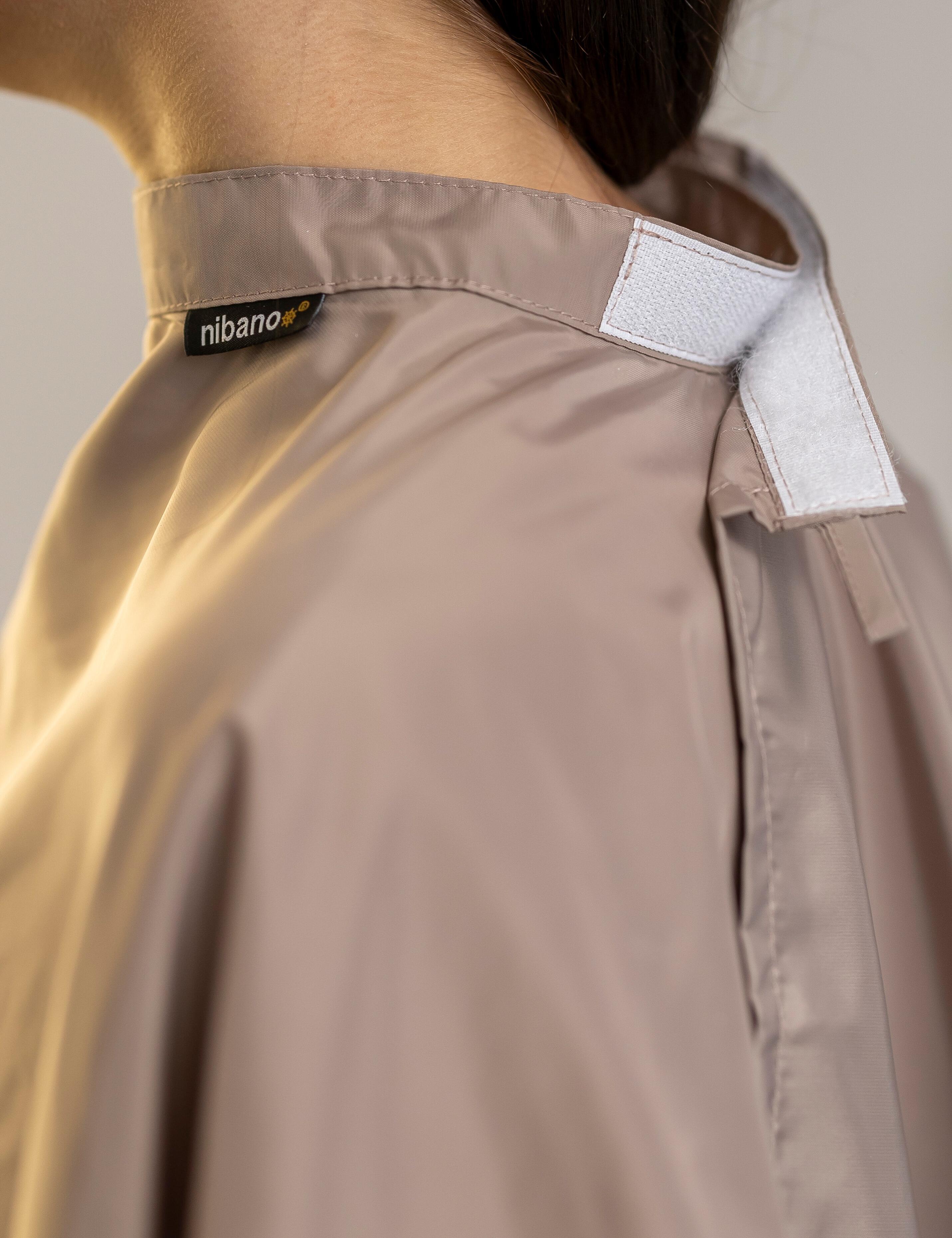 Latte color kids salon cape featuring a quick-release velcro collar