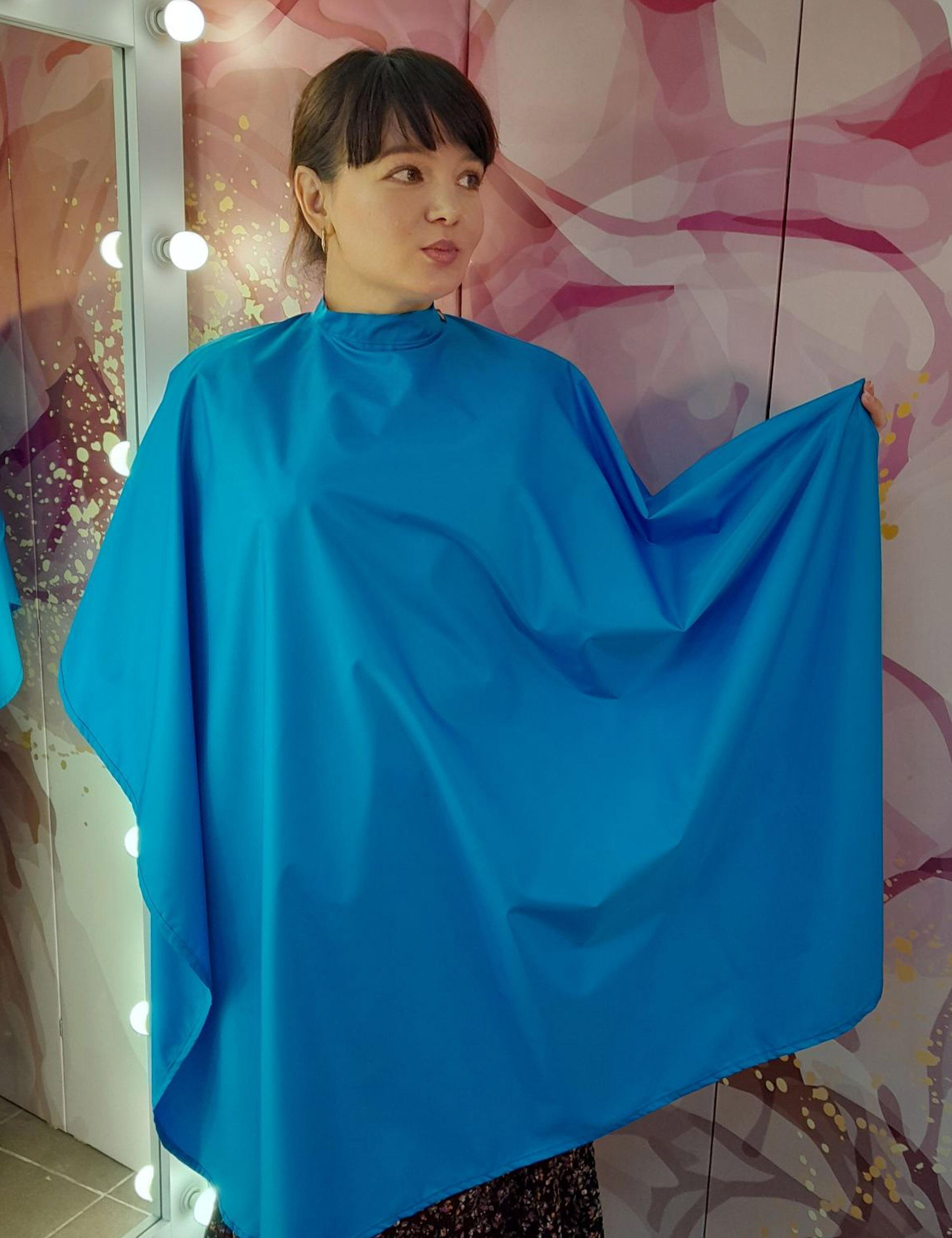 Premium turquoise hair cutting cape available with fast shipping in the USA.