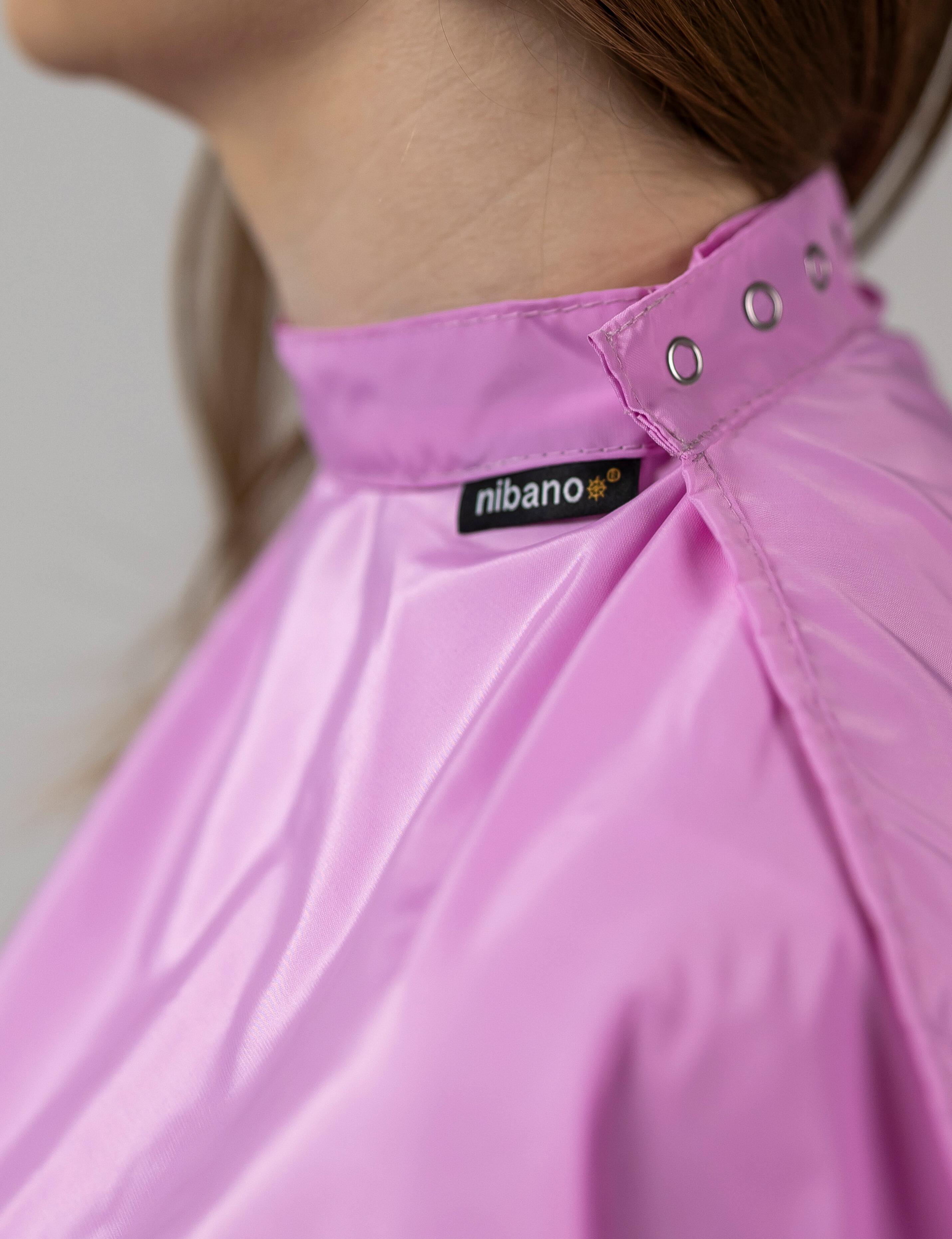 Aesthetic pink styling cape crafted for professional hairdressing and salon services.
