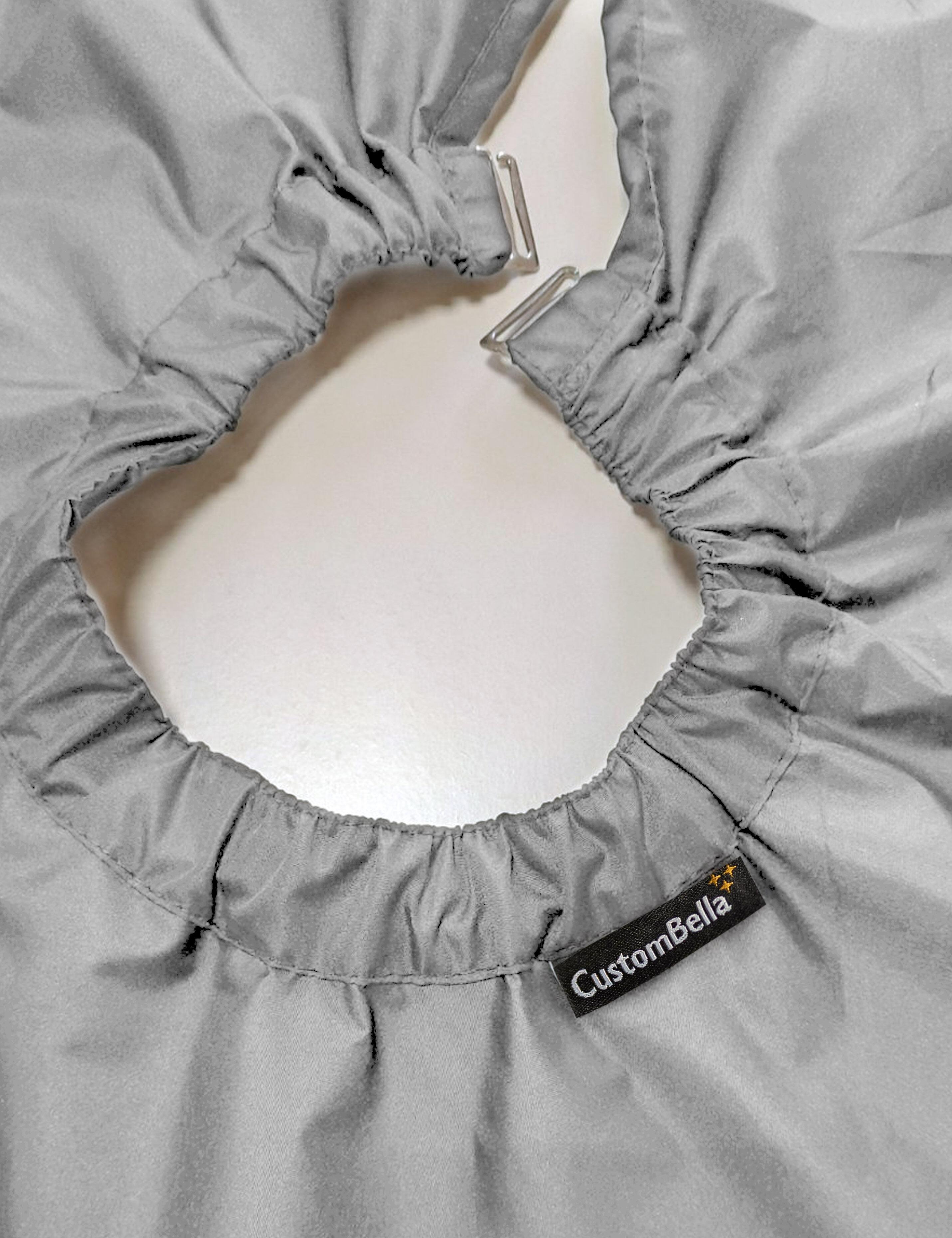 Grey barber drape with hand slits integrated with heavy duty neck clips