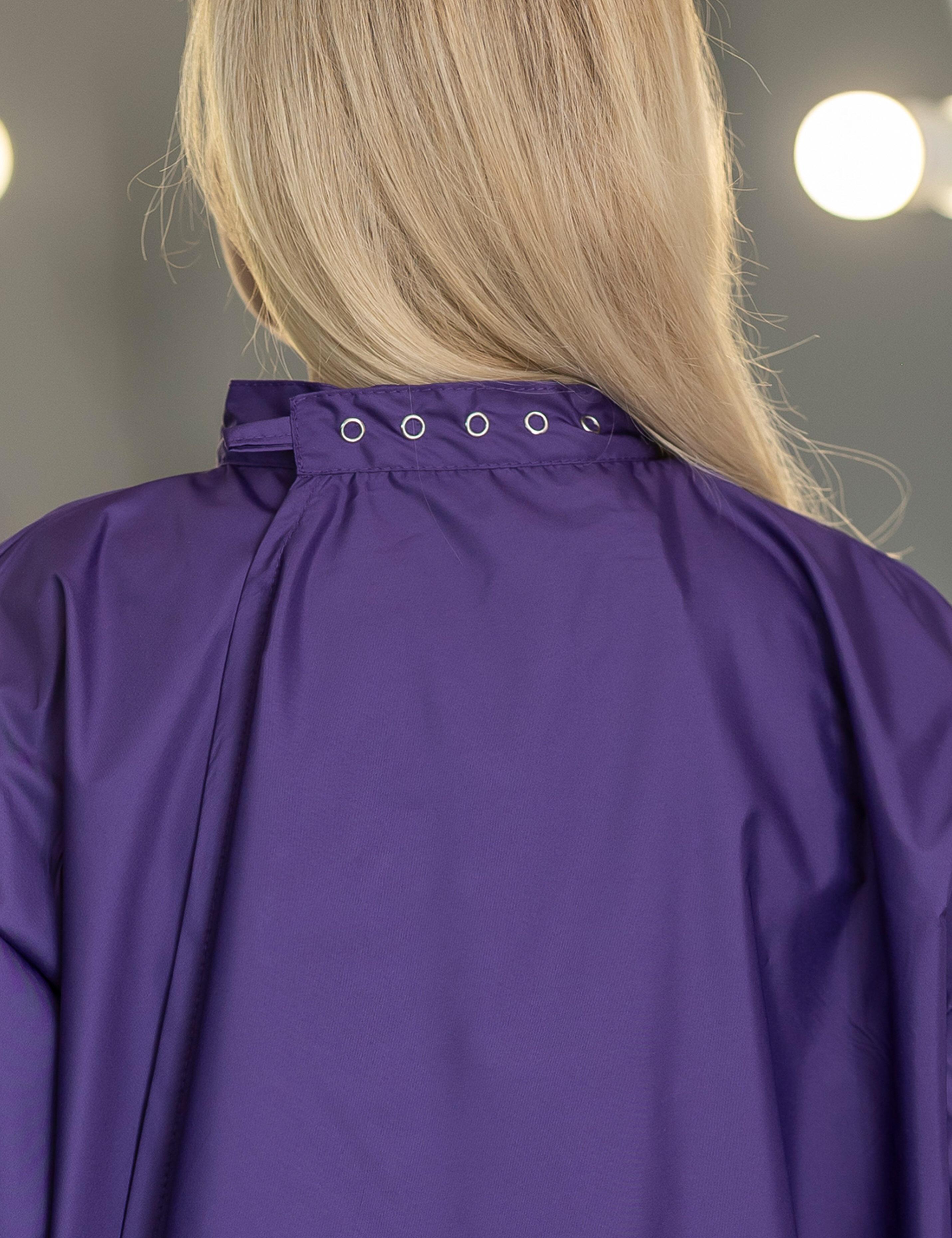 Purple salon uniform cape with sleeves personalized with a custom embroidered business logo