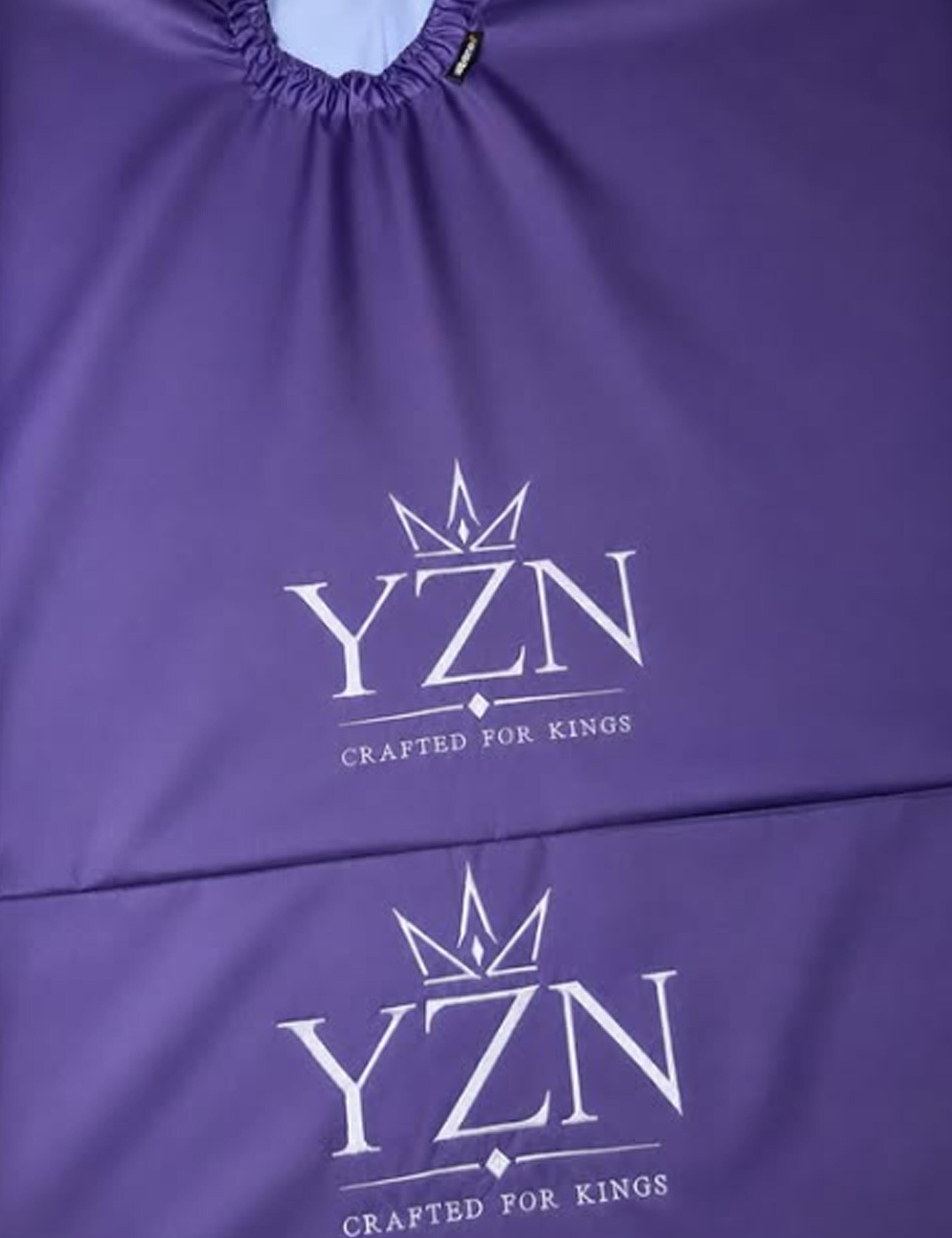 Premium embroidered purple barber cape featuring high-quality branding.