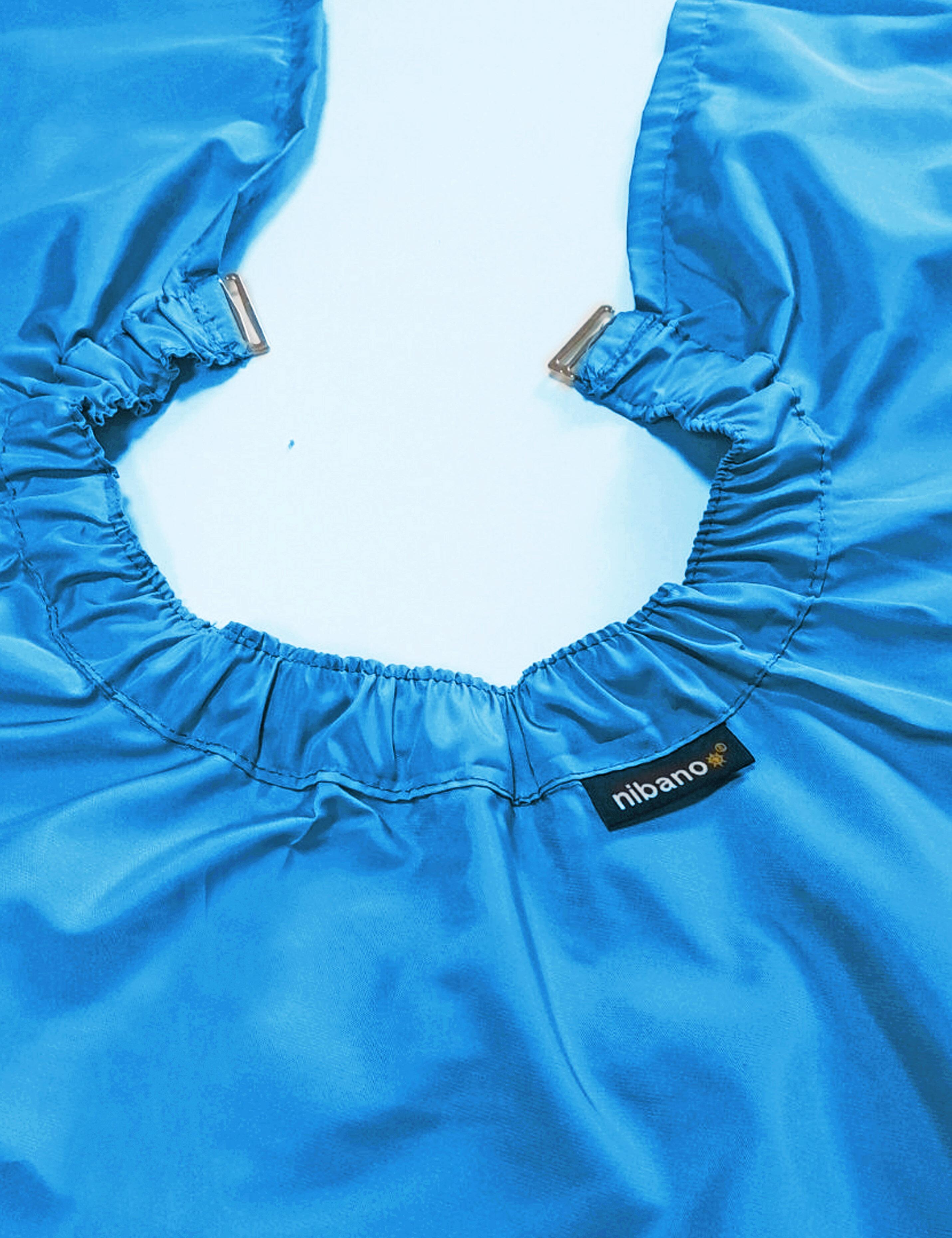 Professional turquoise barber gown equipped with adjustable neck clips for US shops.