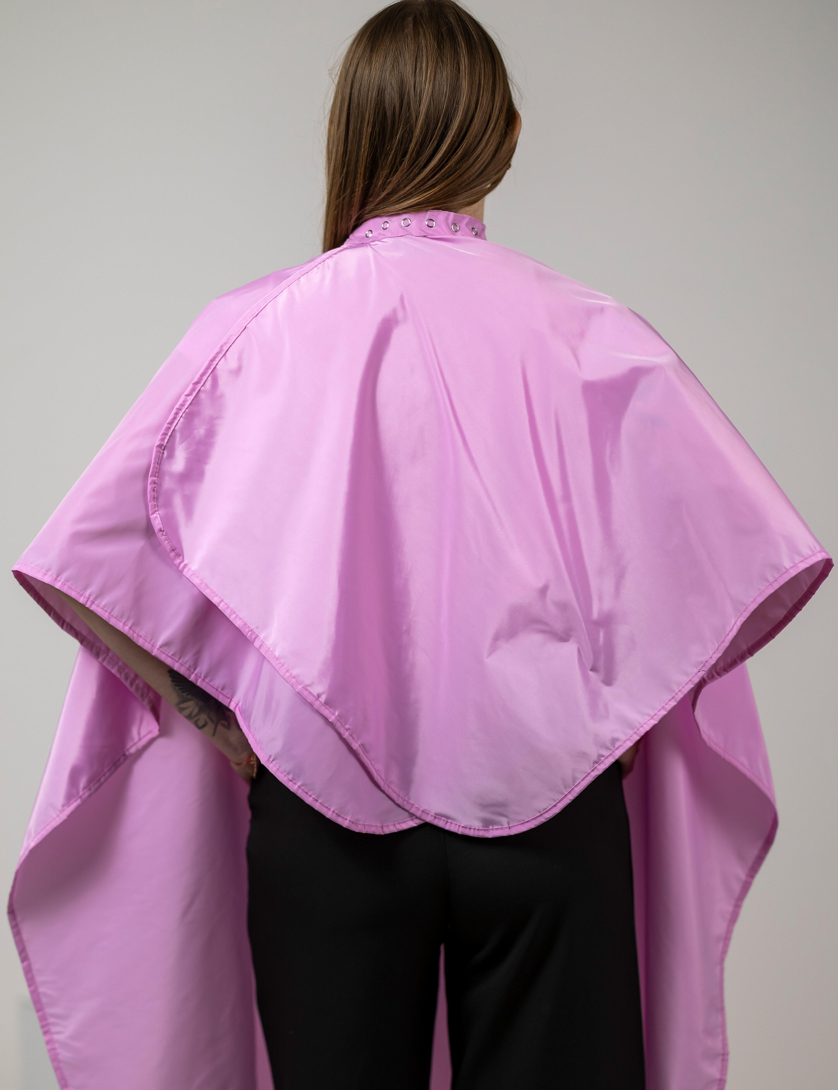Stain-resistant pink barber gown built for everyday commercial hair treatments.