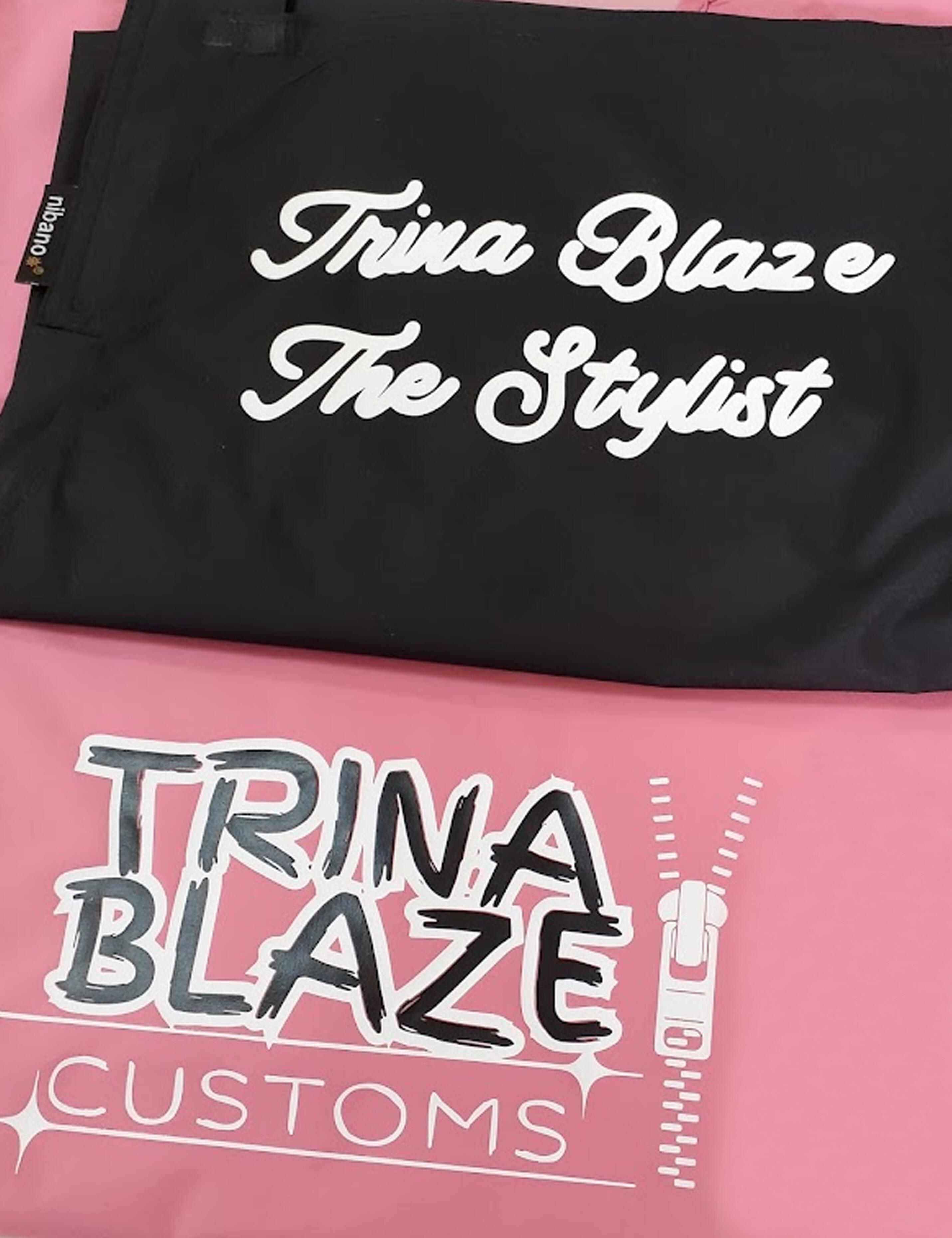 Personalized pink barbie barber cape featuring custom-designed graphic prints.