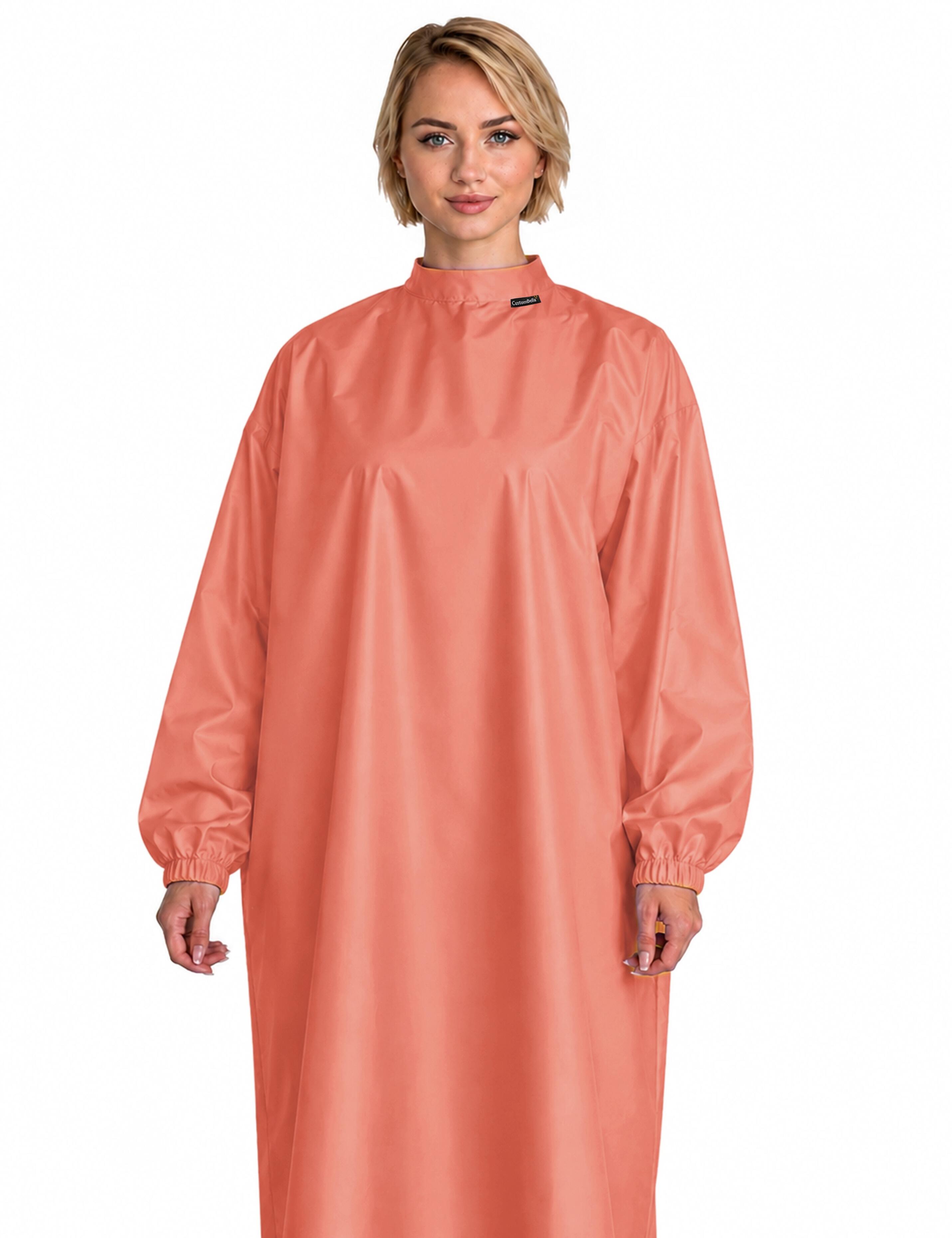 Cozy peach client cape with integrated sleeves designed for ultimate relaxation and a high-end studio vibe
