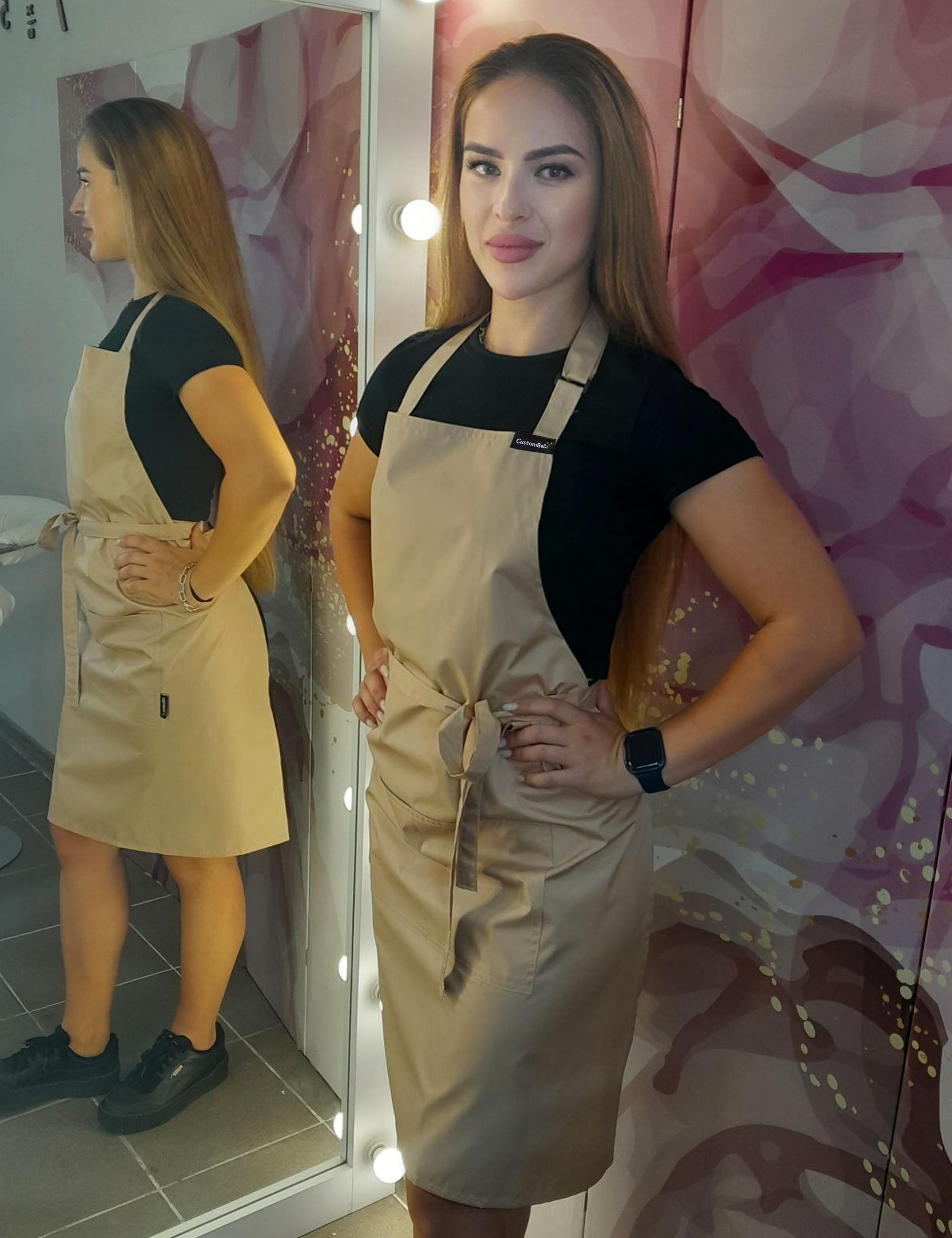 Professional grade cappuccino waterproof utility apron engineered for busy beauty studios