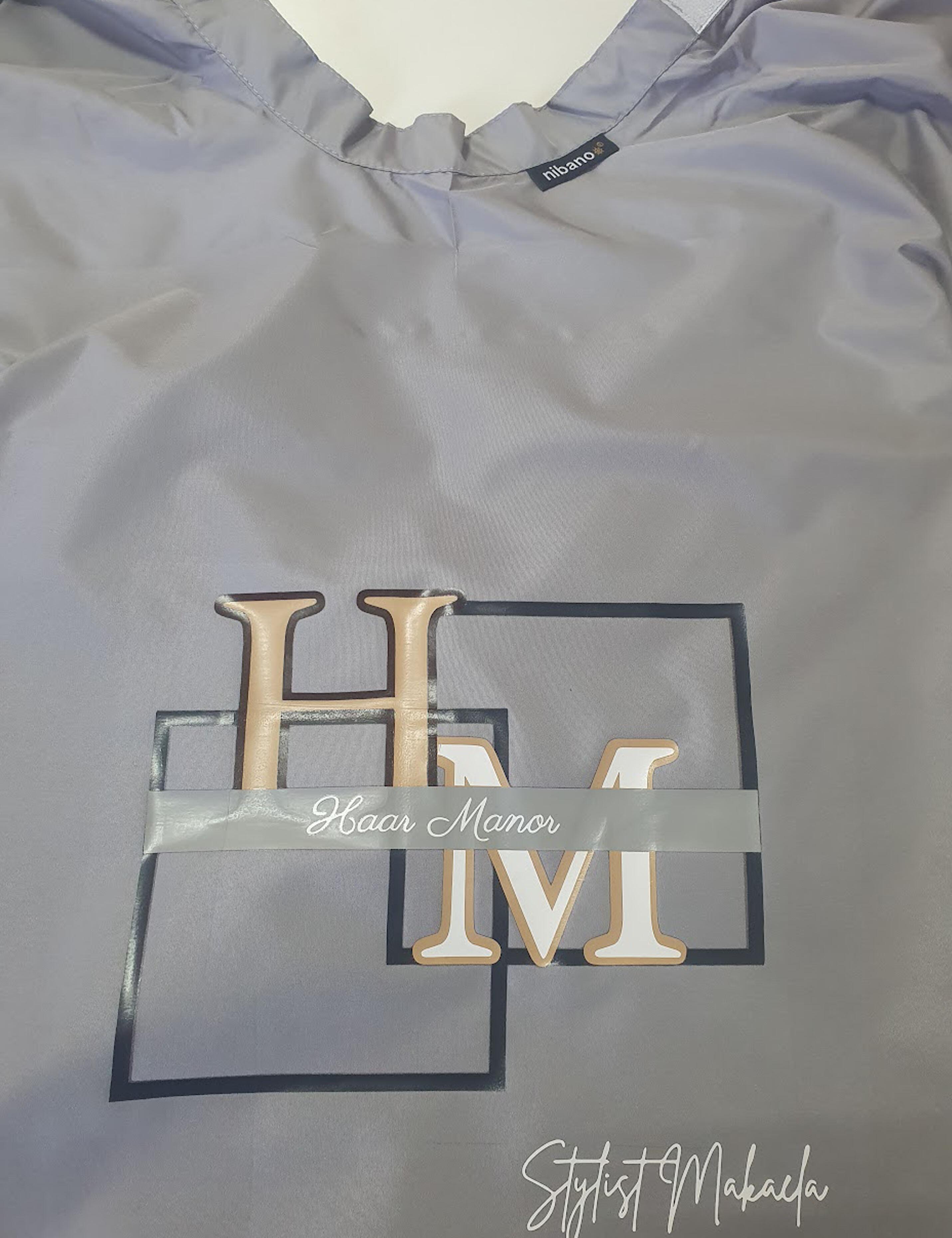 Custom printed grey barber cape with branded logo for USA businesses