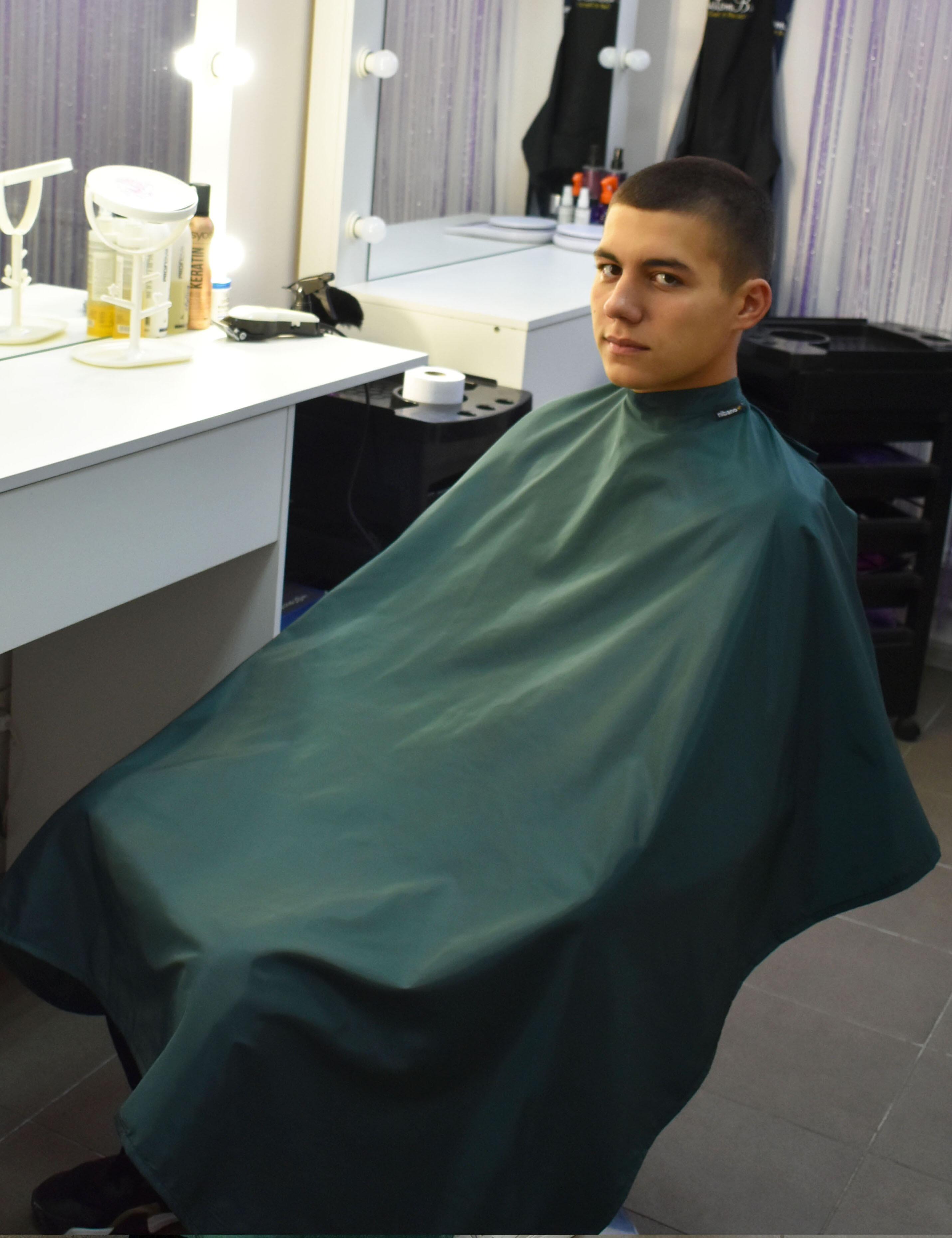 Professional bottle green salon cape for hair stylists and barbershops in the USA