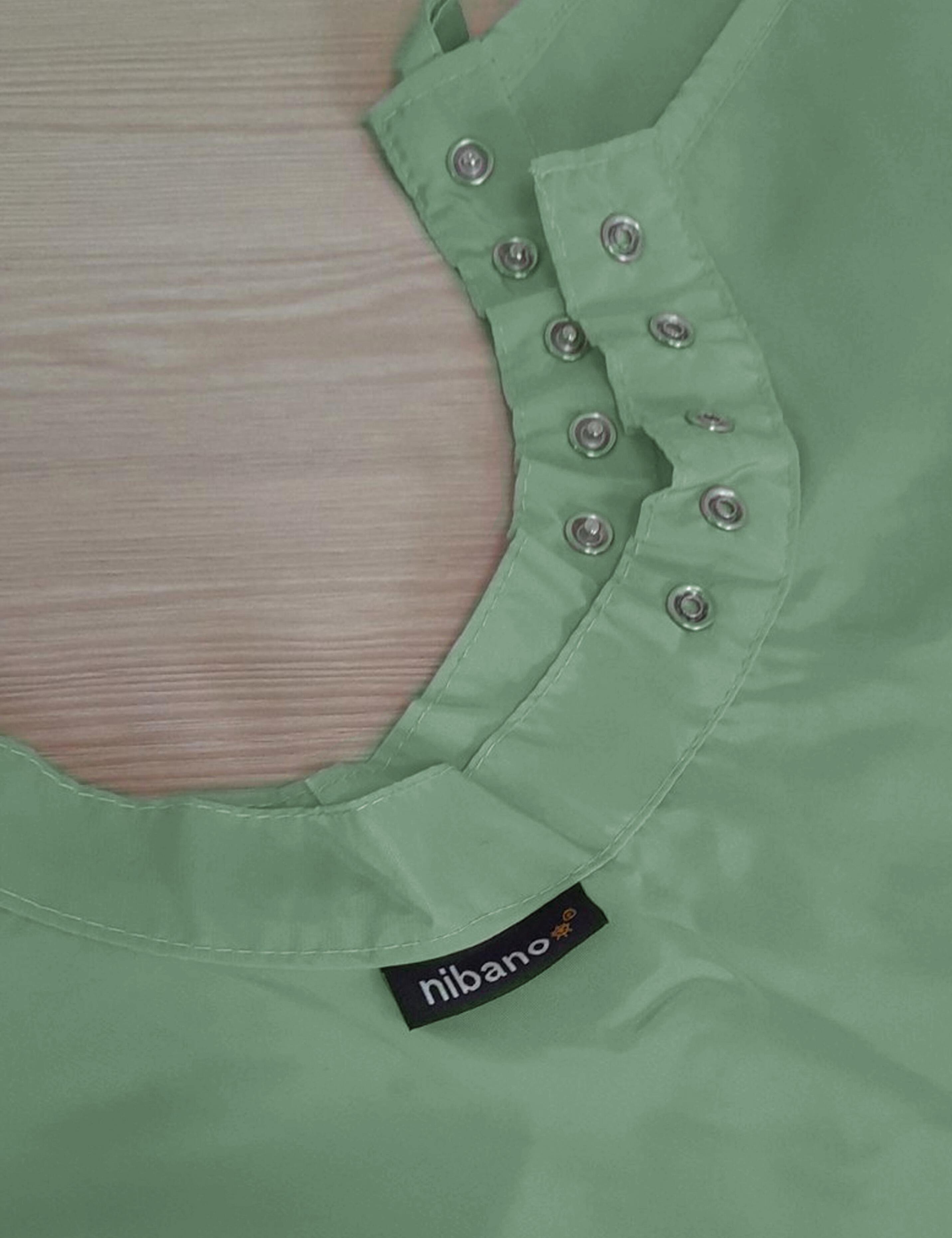 Olive hair styling cape outfitted with adjustable snap fasteners