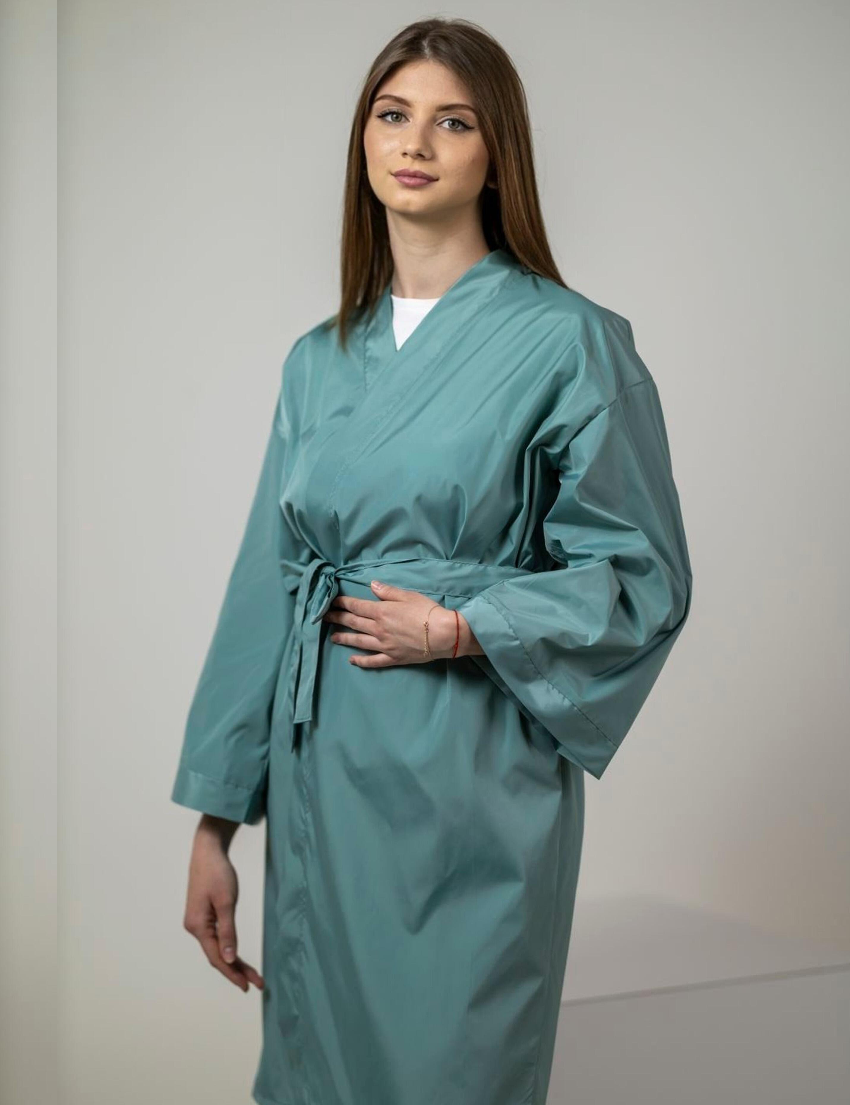 Calming sage colored salon wrap robe creating a relaxing atmosphere for beauty guests