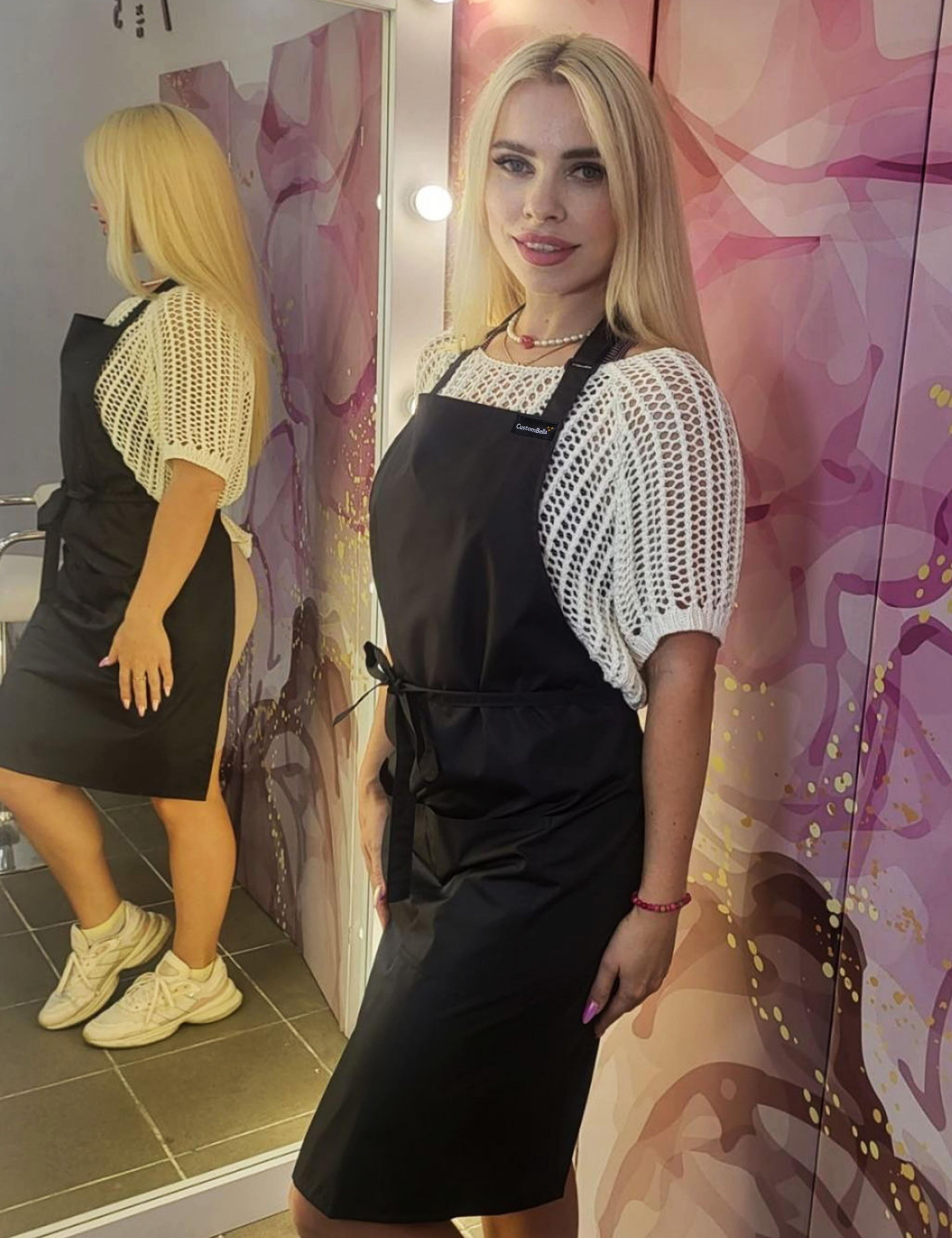 Professional grade black waterproof utility apron engineered for busy beauty studios