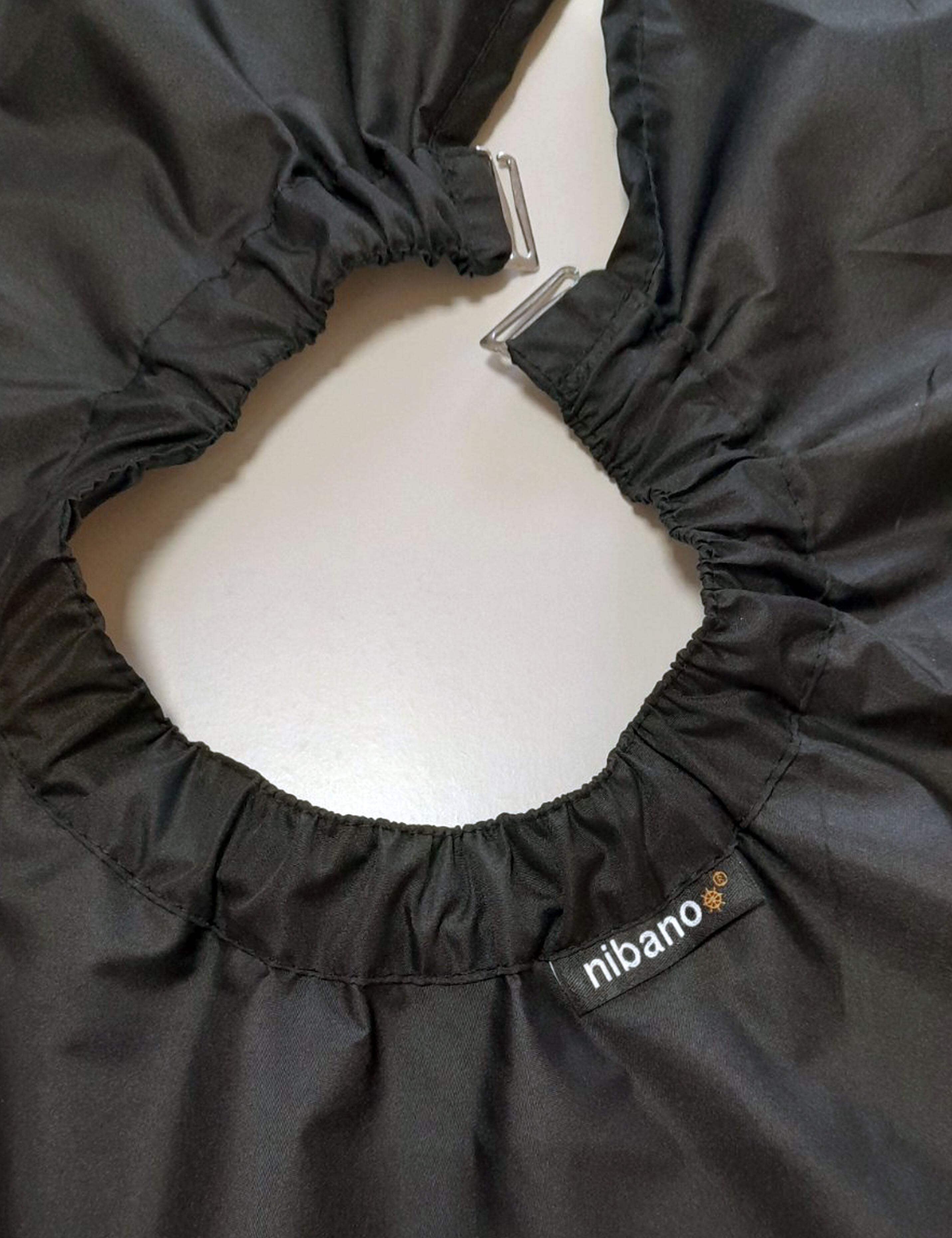 Professional black salon cape with clip closure for adjustable neck fit