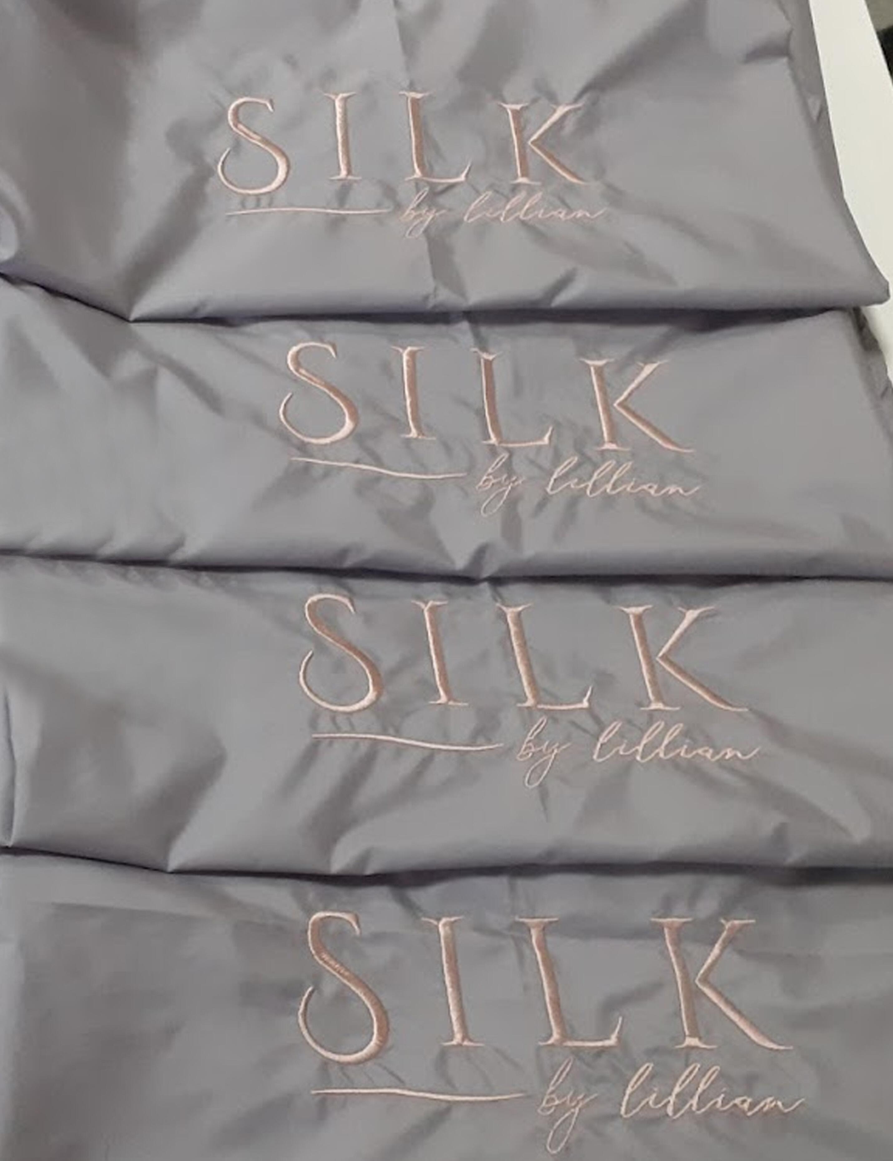 Premium embroidered grey salon cape with custom personalized logo