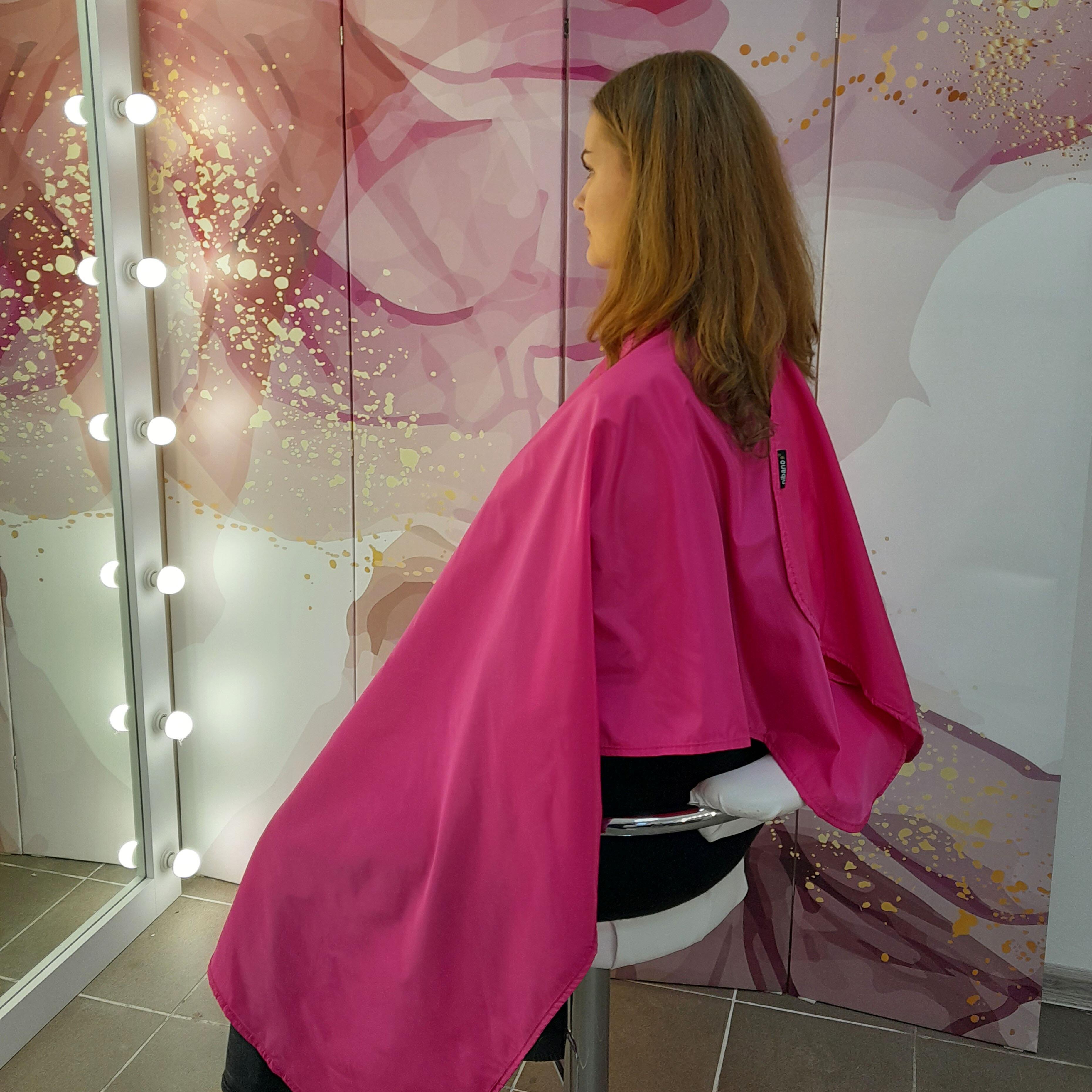 Vibrant hot pink hair salon cape tailored for boutique beauty businesses.