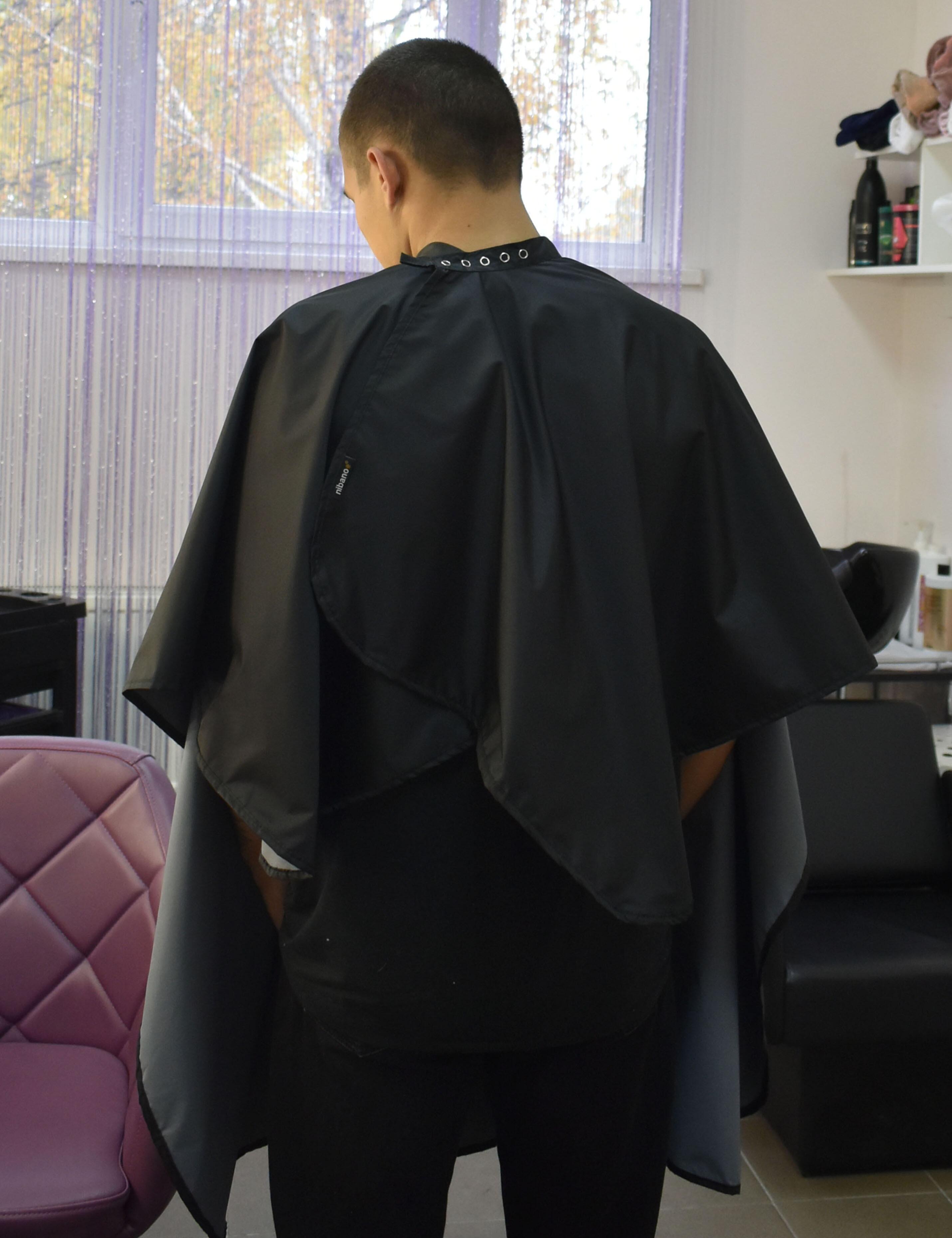 Water-resistant black salon cape blank with adjustable snap closure