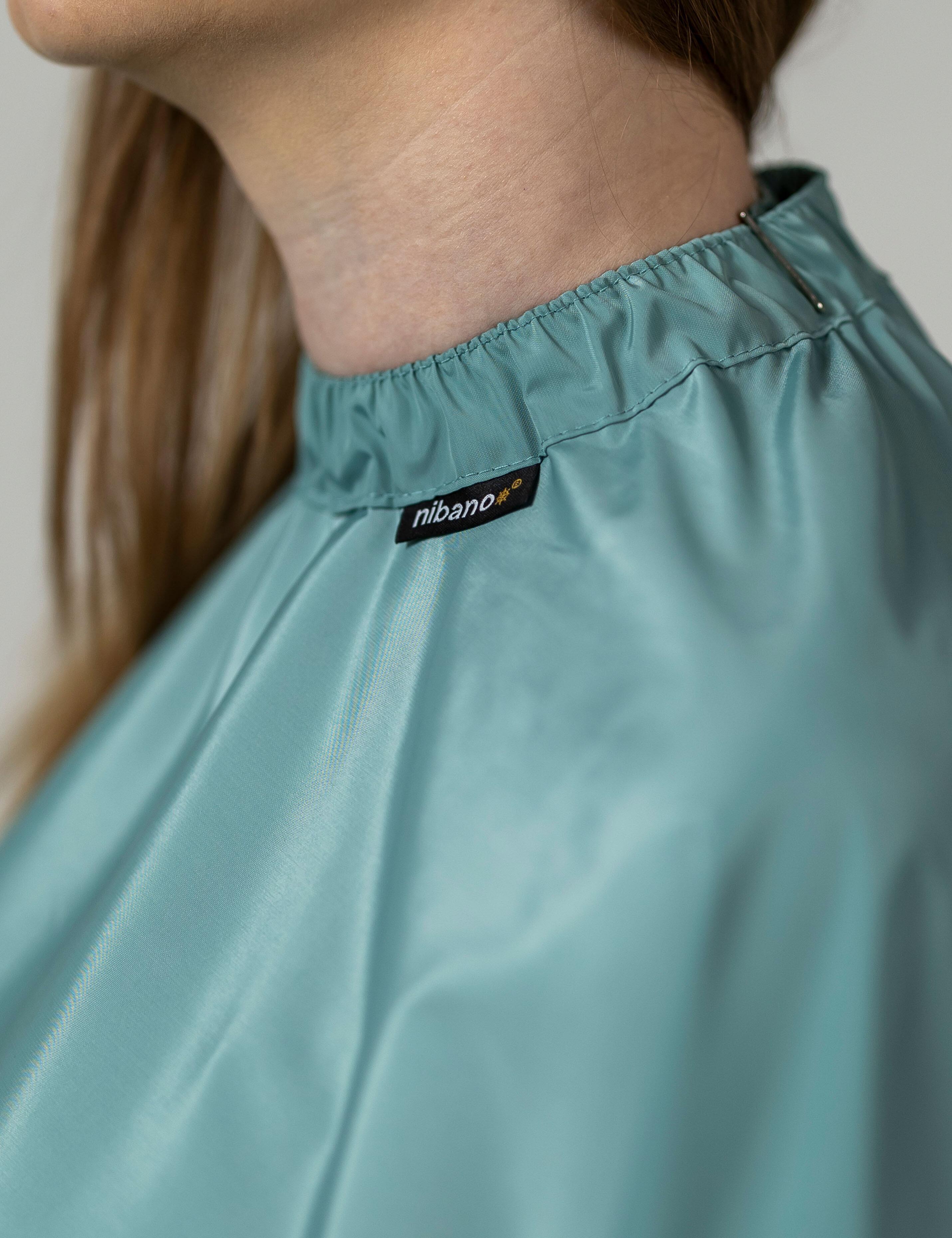Premium sage green hair cutting cape available with fast shipping in the USA