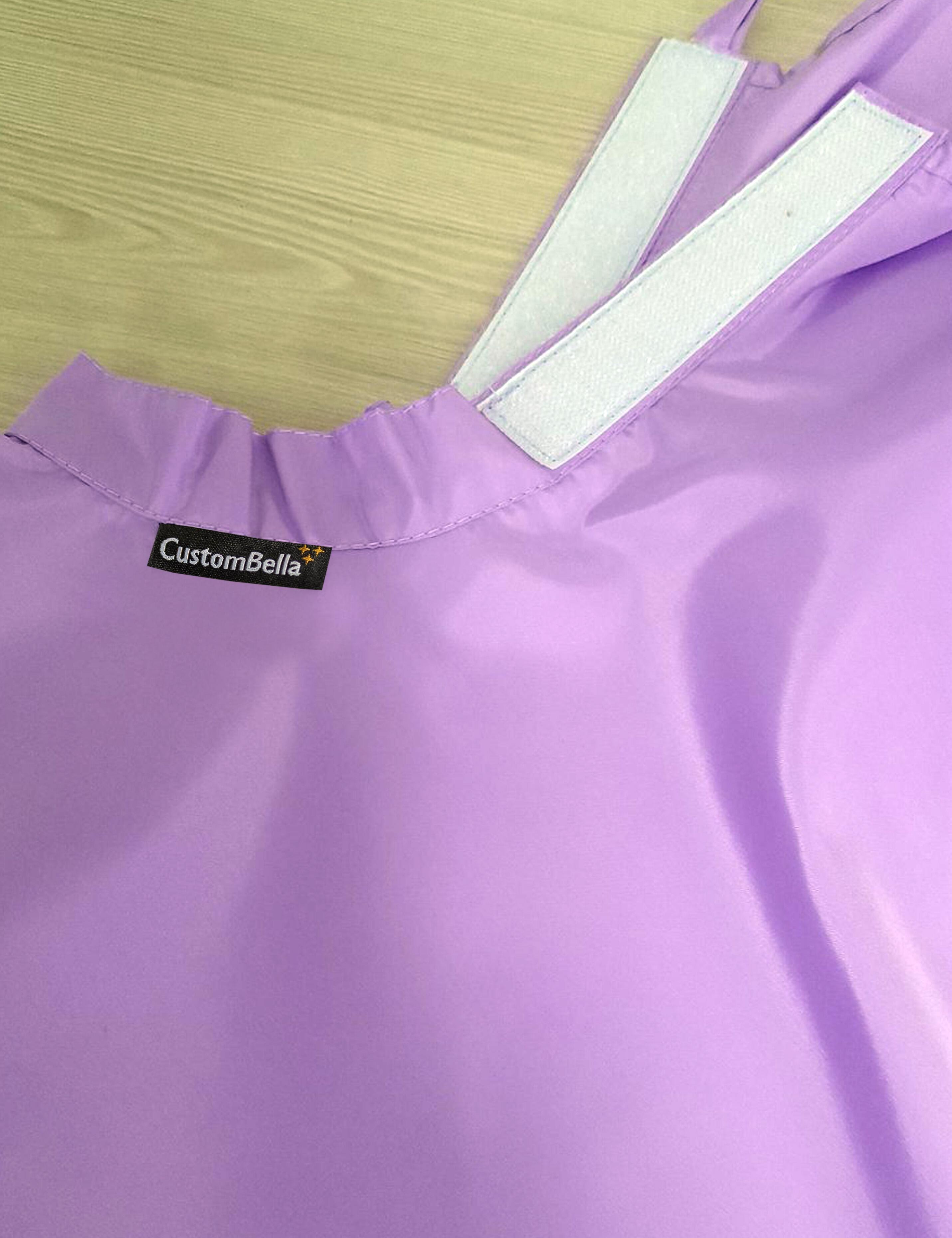 Lilac kids salon cape with an adjustable velcro neck closure