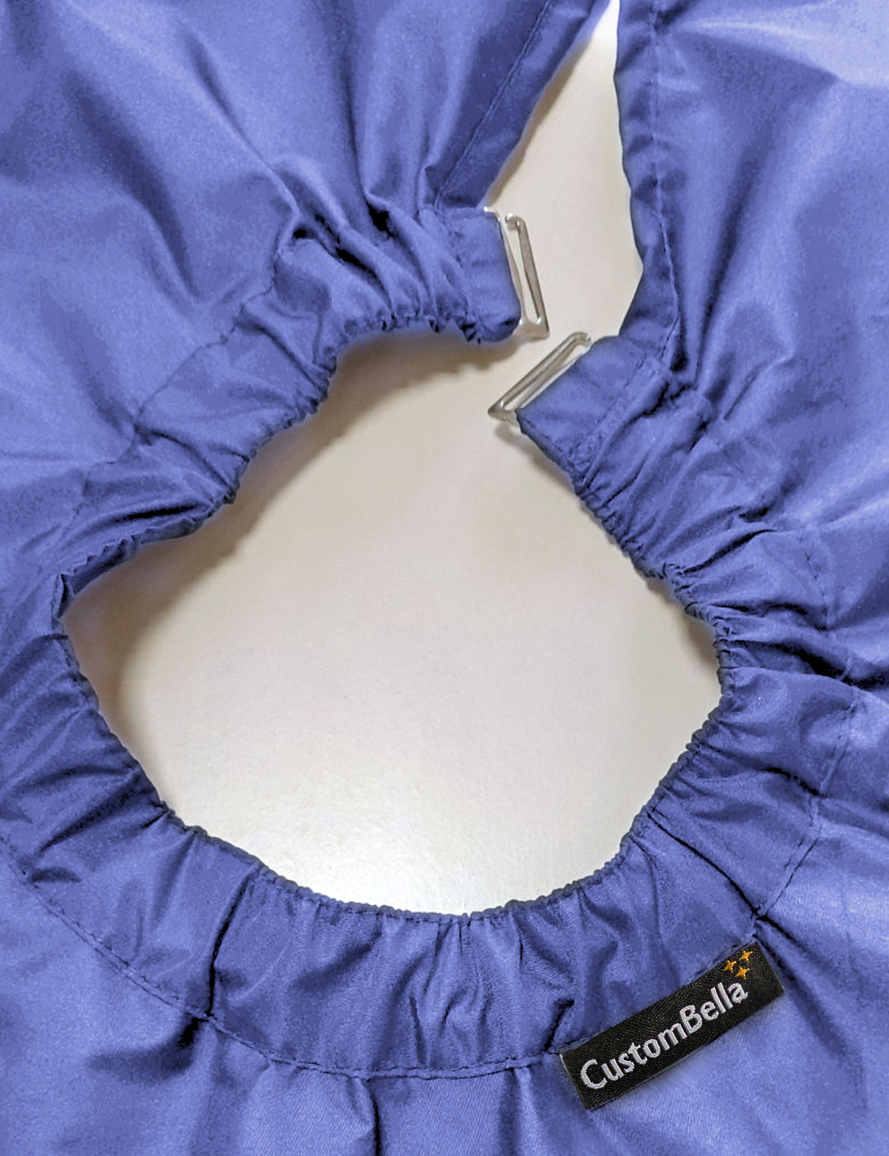 Denim blue salon cape with hand slits and secure clip closure
