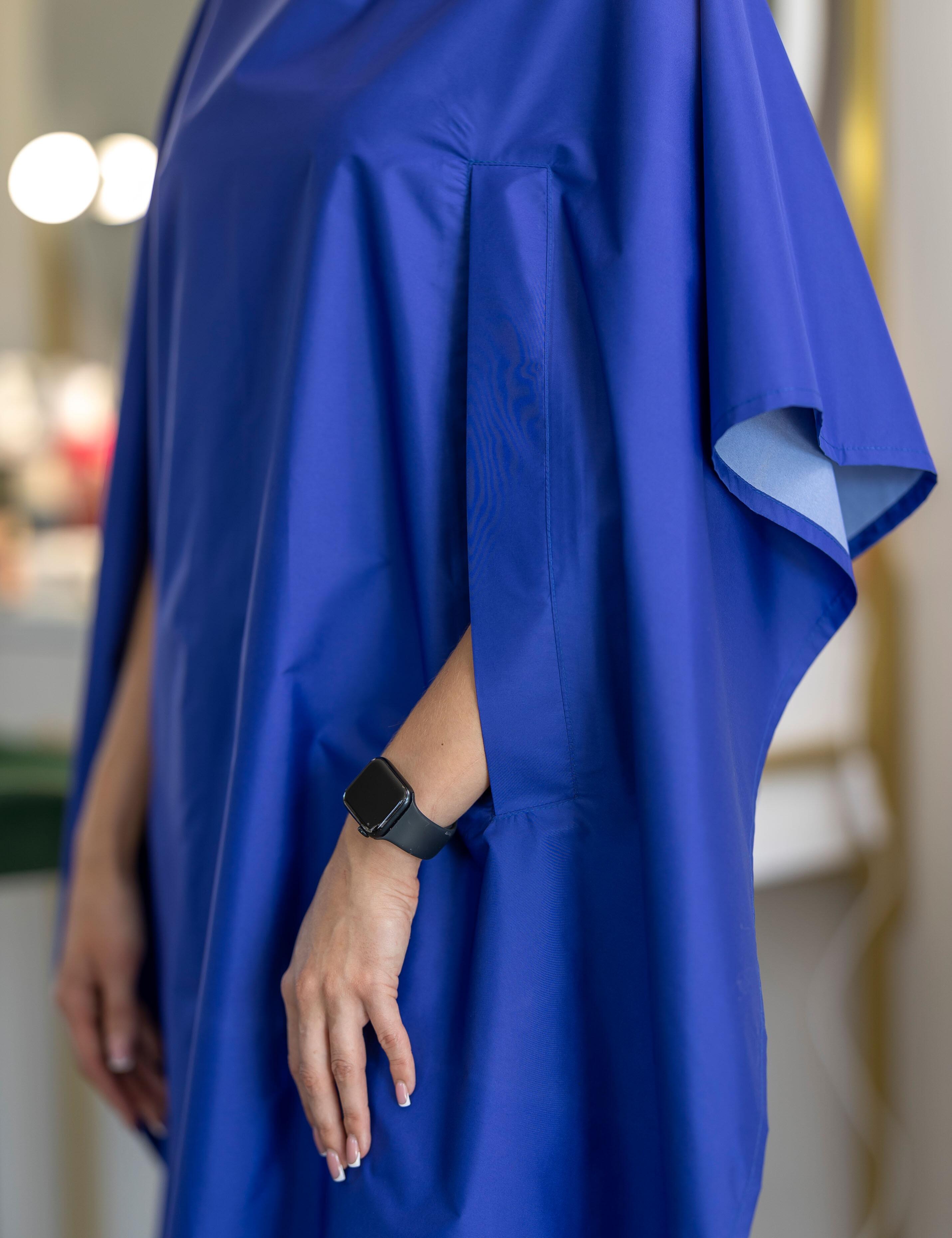 Stylish royal blue salon gown with slits for client hands