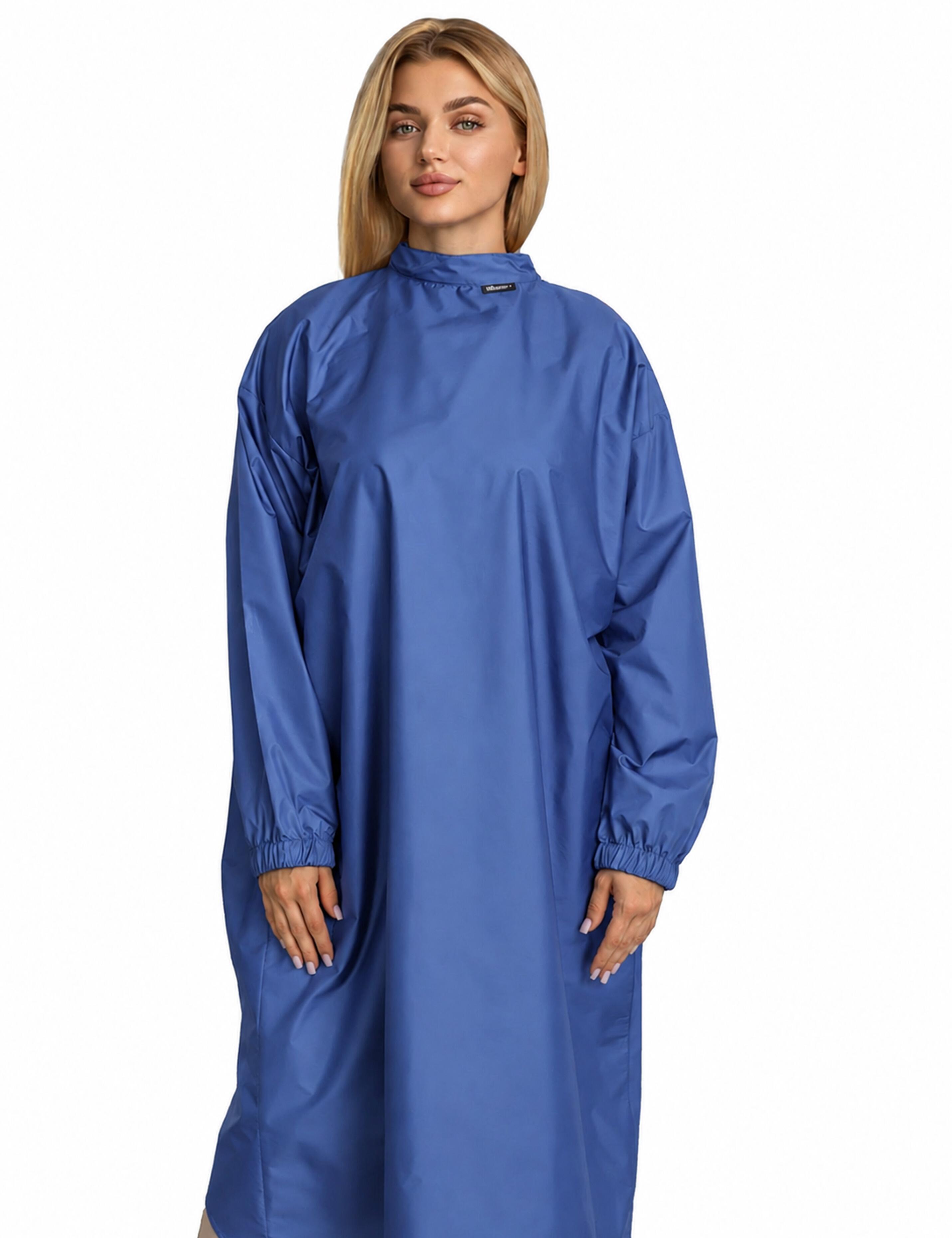 Denim blue salon styling cape featuring built-in sleeves for total client mobility and phone use