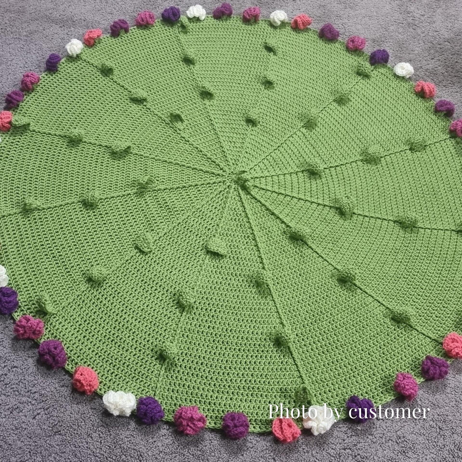 Customer photo of finished Bouquet Blanket – crochet blanket with decorative edging photographed flat.