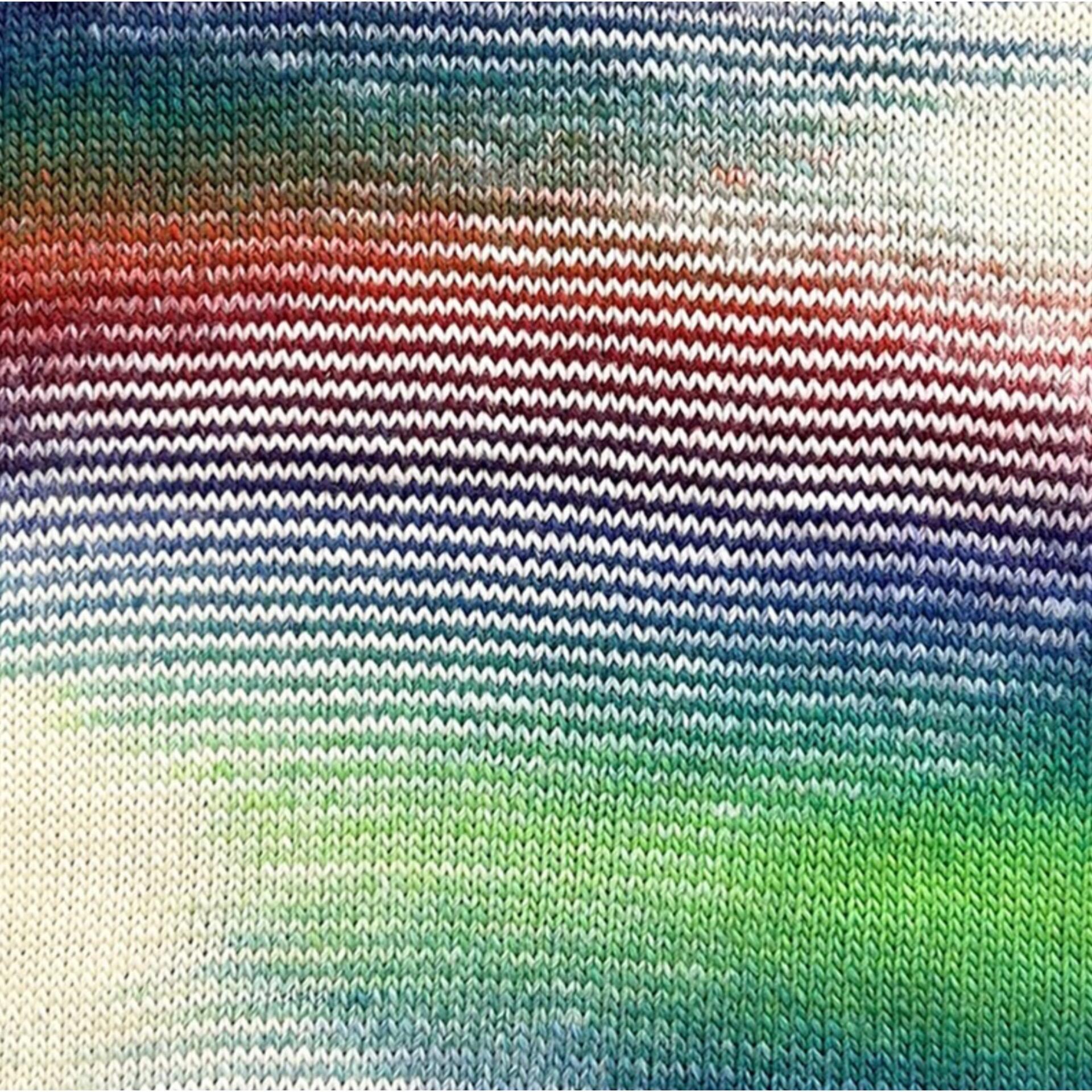 Knitted swatch of Stylecraft Knit Me Crochet Me Kaleidoscope yarn – self-striping DK with rainbow shades of red, green, blue, and cream in blended stripes