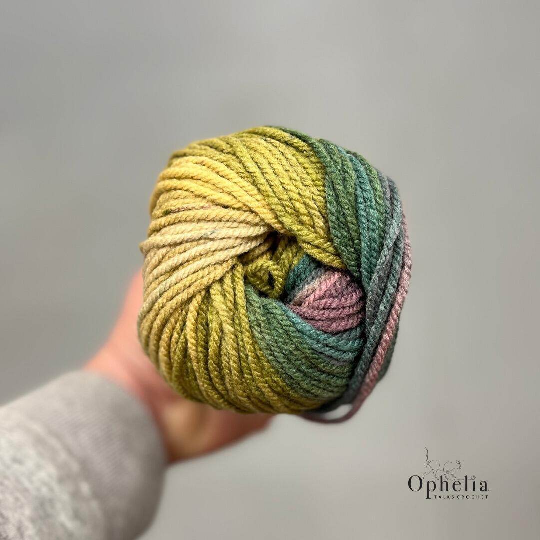 Top view of James C Brett Aurora Chunky Bramble Bush AC06 highlighting smooth colour transitions in green, olive, and muted pink tones.