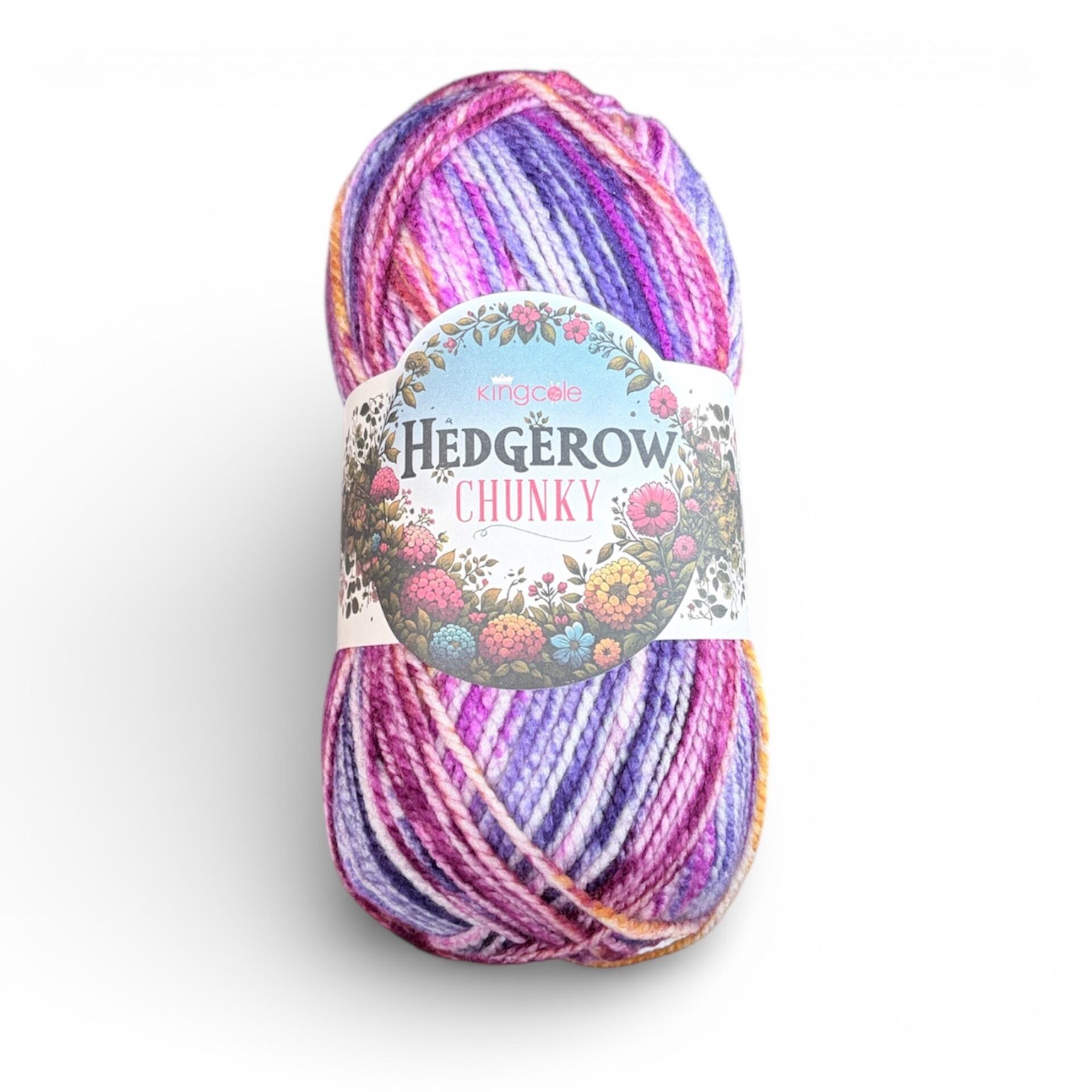 Ball of King Cole Hedgerow Chunky yarn in Heather 5850, 200g variegated purple and pink 100% acrylic chunky yarn on a white background.